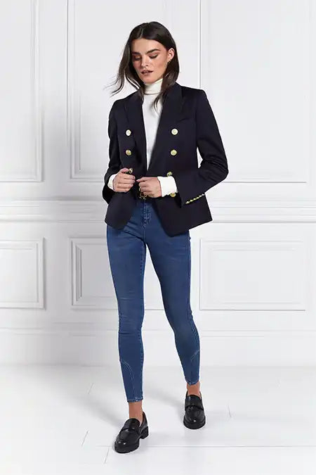 British made double breasted blazer that fastens with a single button hole to create a more form fitting silhouette with two pockets and gold button detailing this blazer is made from navy barathea fabric