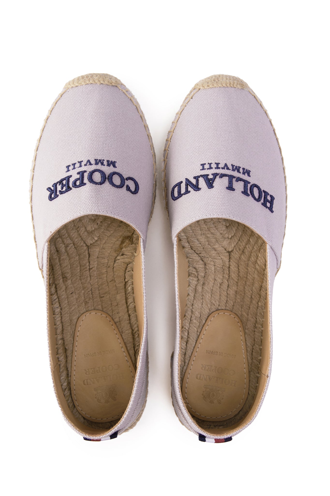 classic style light pink canvas espadrille with plaited jute sole and jute toe cap with navy embroidered branding on top and red, white and blue tag to heel