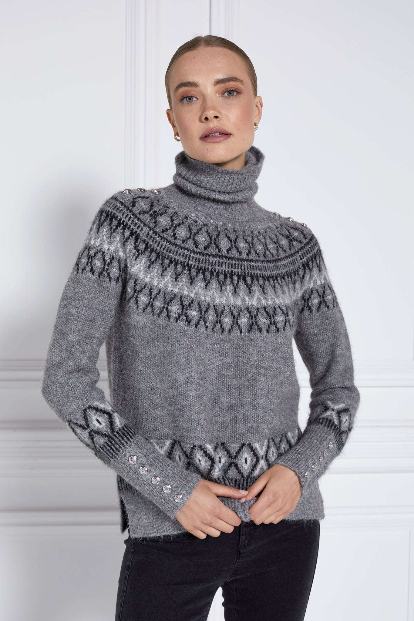 womens classic grey roll neck jumper with fairisle knit in black and white around the shoulders waistline and cuffs and a split ribbed hem