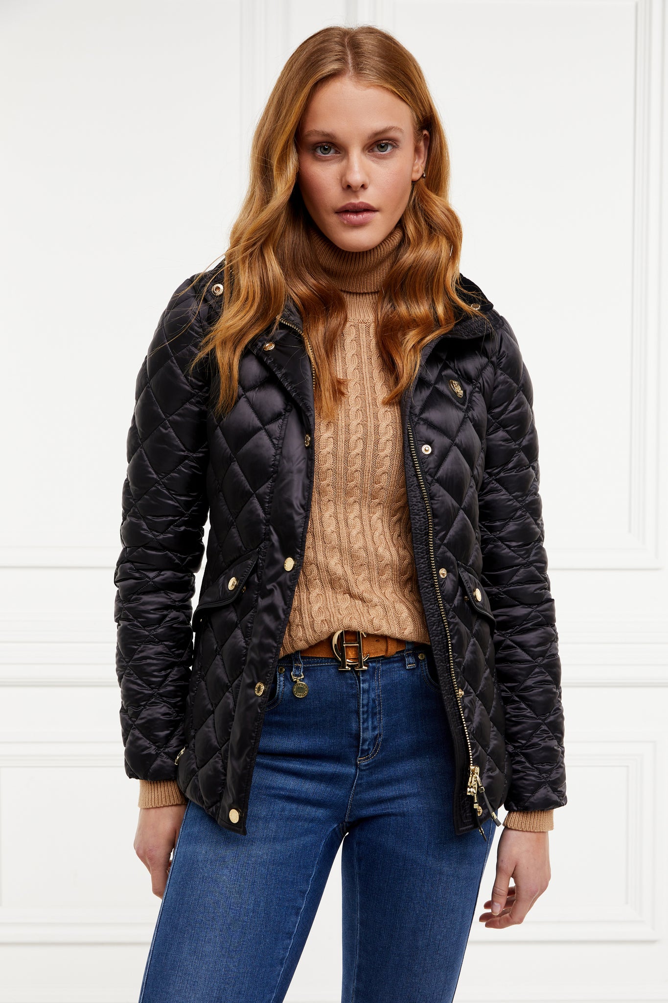 womens diamond quilted black jacket with contrast black leather elbow and shoulder pads large front pockets and shirred side panels