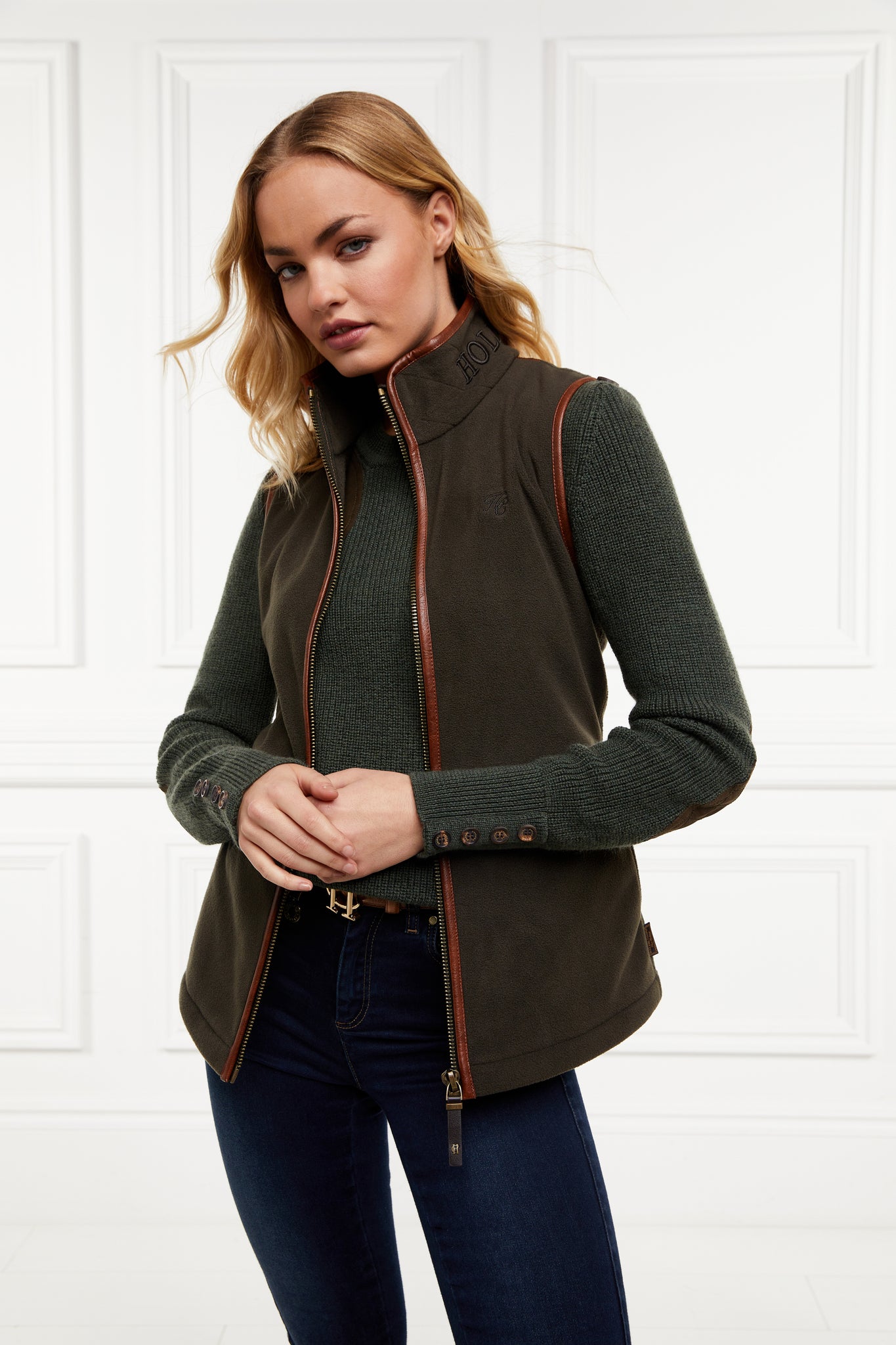womens fleece gilet in khaki with tan leather piping around armholes neckline and down the front zip fastening