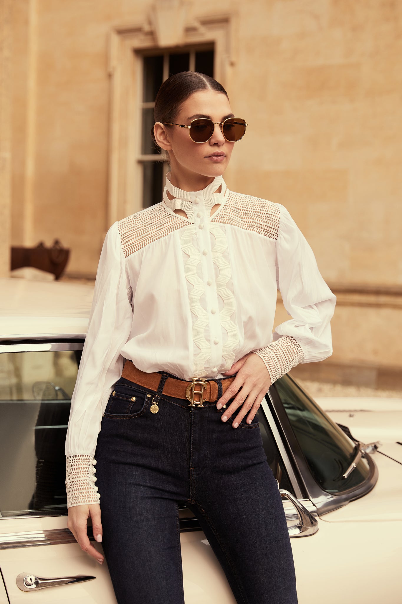 womens white shirt with lace detail to the collar shoulders and arm cuffs and balloon sleeve and womens indigo jean