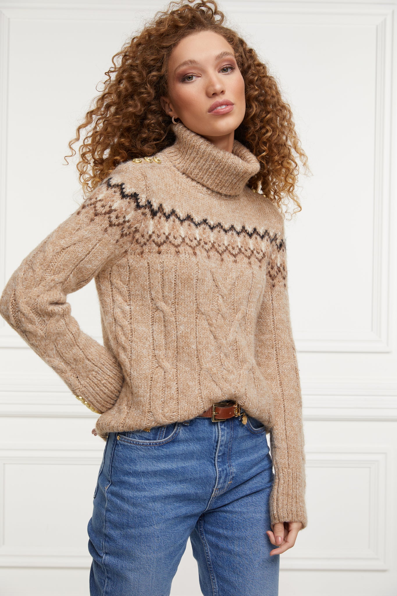 high roll neck cable knit jumper in camel with a black cream and dark camel fairisle knit detail across the chest around the upper arm and back