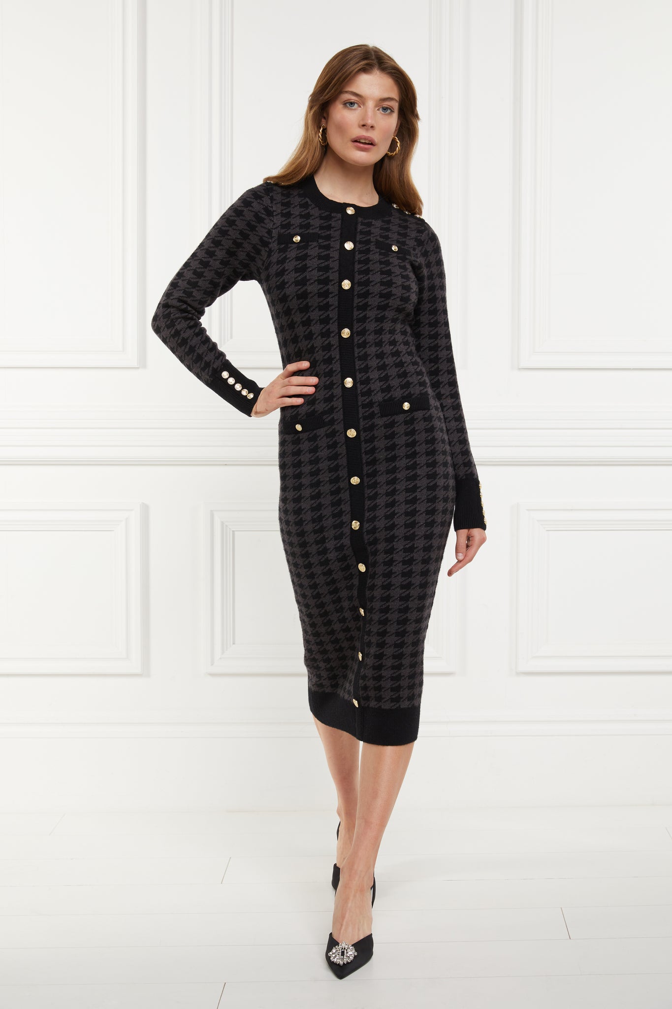 womens slim fit crew neck long sleeve knitted midi dress in grey and black houndstooth with gold button detail on contrast black panel down the centre front and two black contrast welt pockets on chest and two on the hips with gold buttons on the centre of each and contrasting black ribbed hem neckline and cuffs