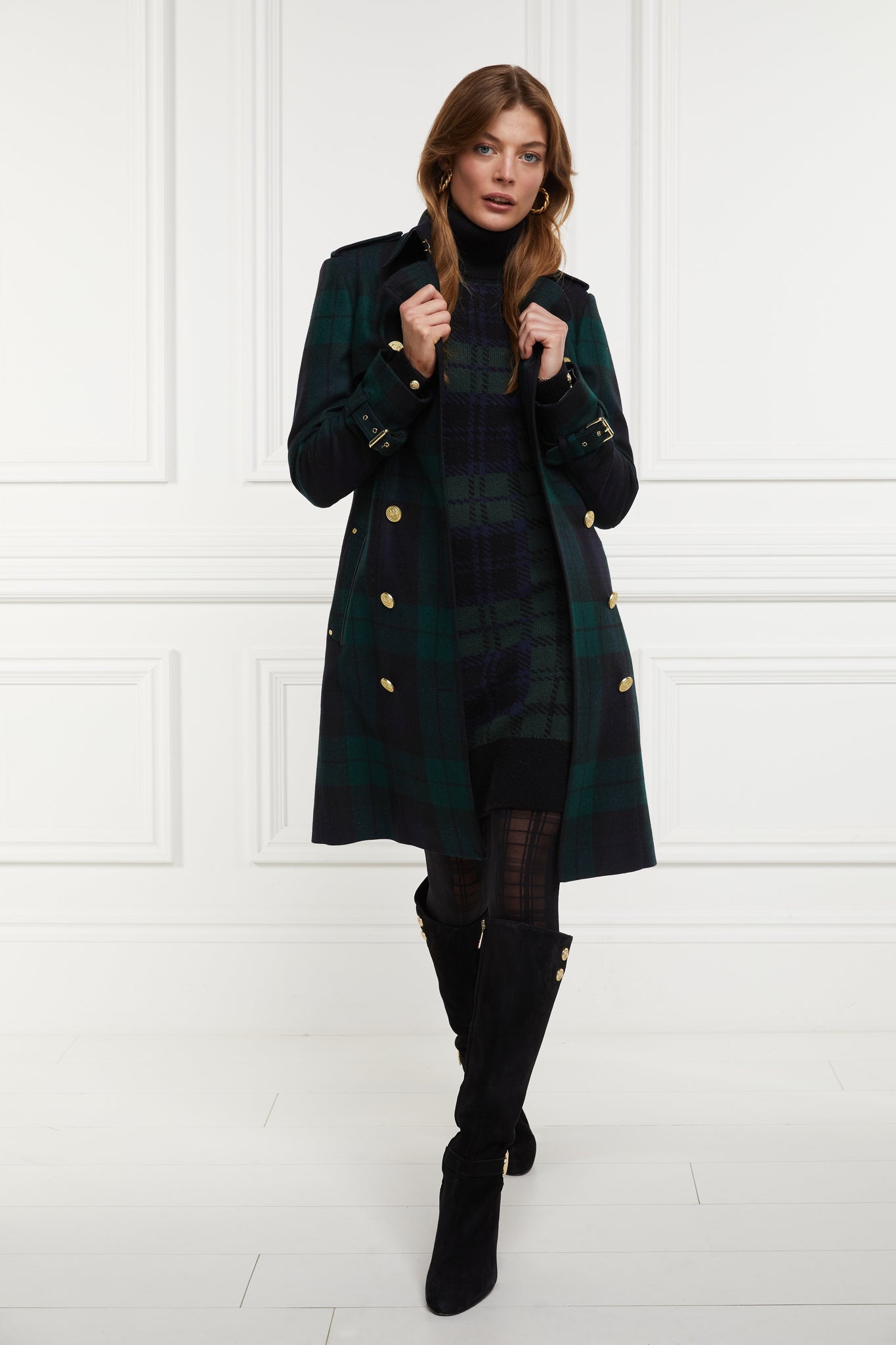 womens green navy and black blackwatch roll neck jumper dress with contrast black cuffs and ribbed hem with gold button detail on the cuffs and shoulder under blackwatch mid length trench coat