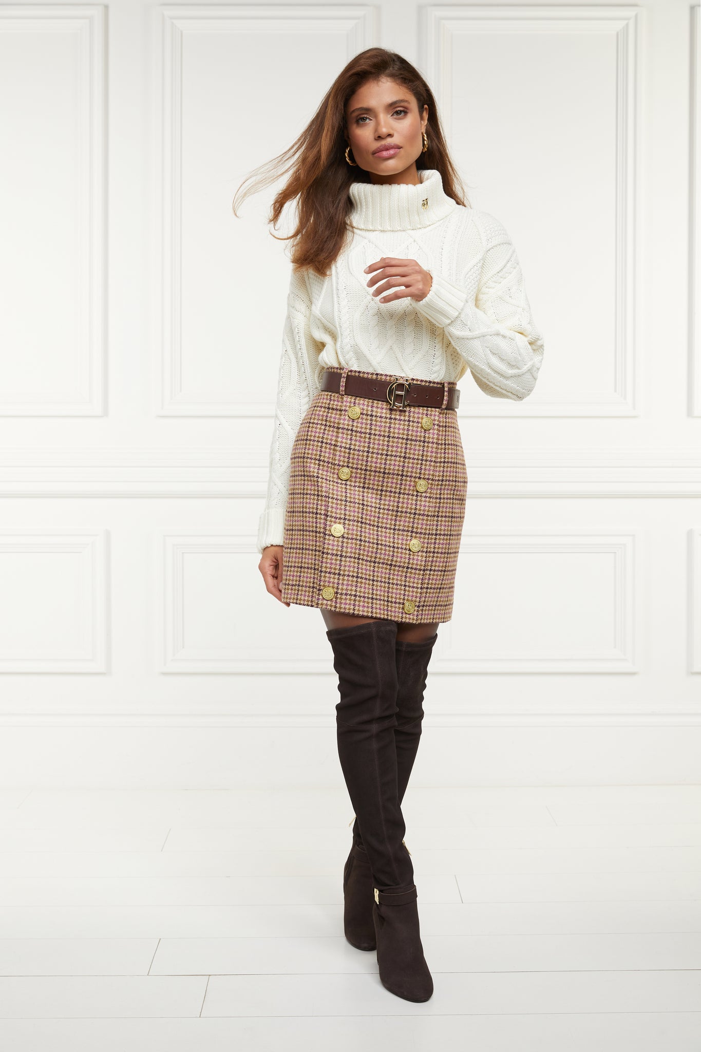 womens wool pencil mini skirt in pink check with concealed zip fastening on centre back and gold rivets down front