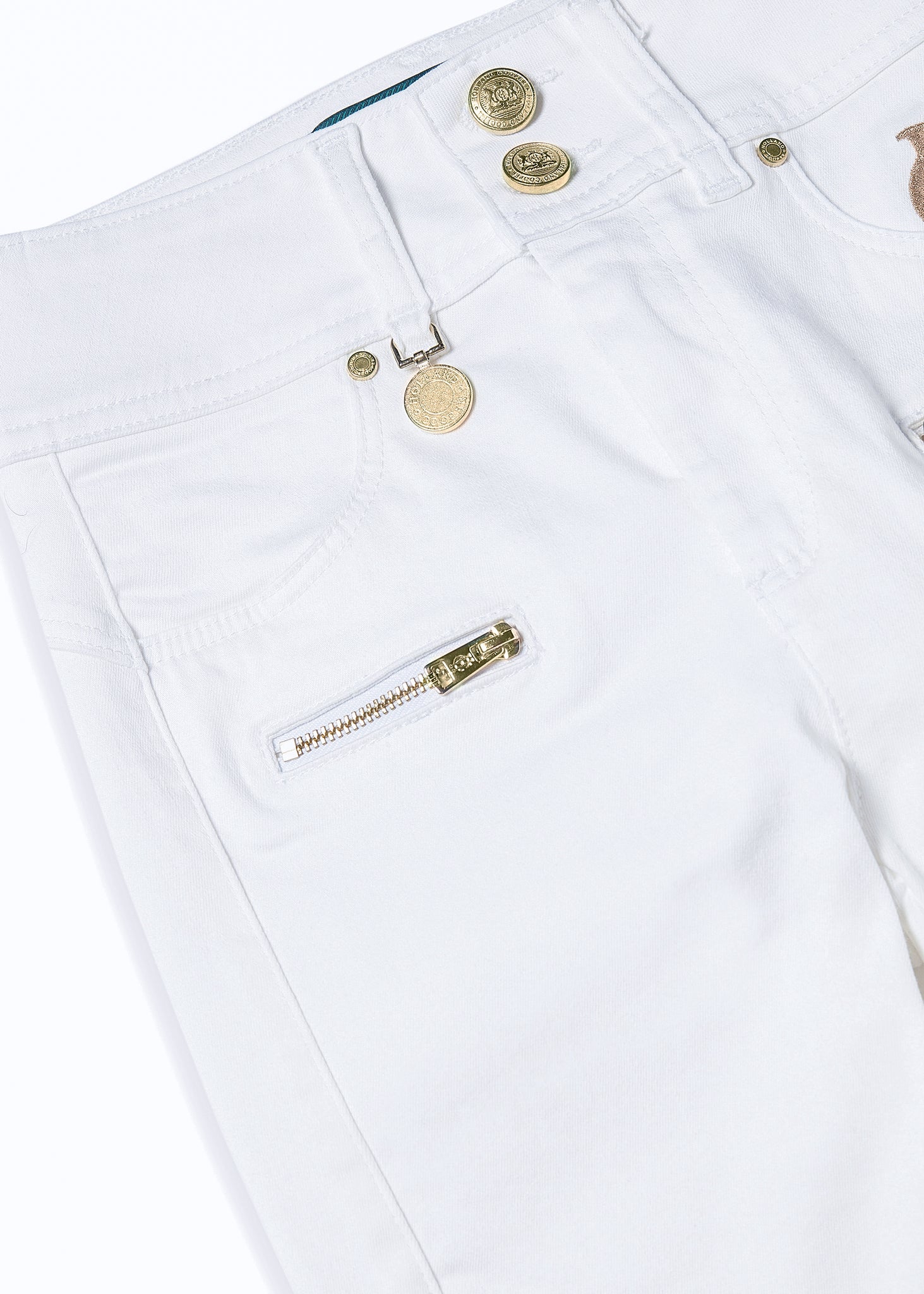front pocket detail on womens high rise white skinny stretch jean with pin tuck biker panels to front and two open zip pockets on front with HC embroidery to left pocket facing