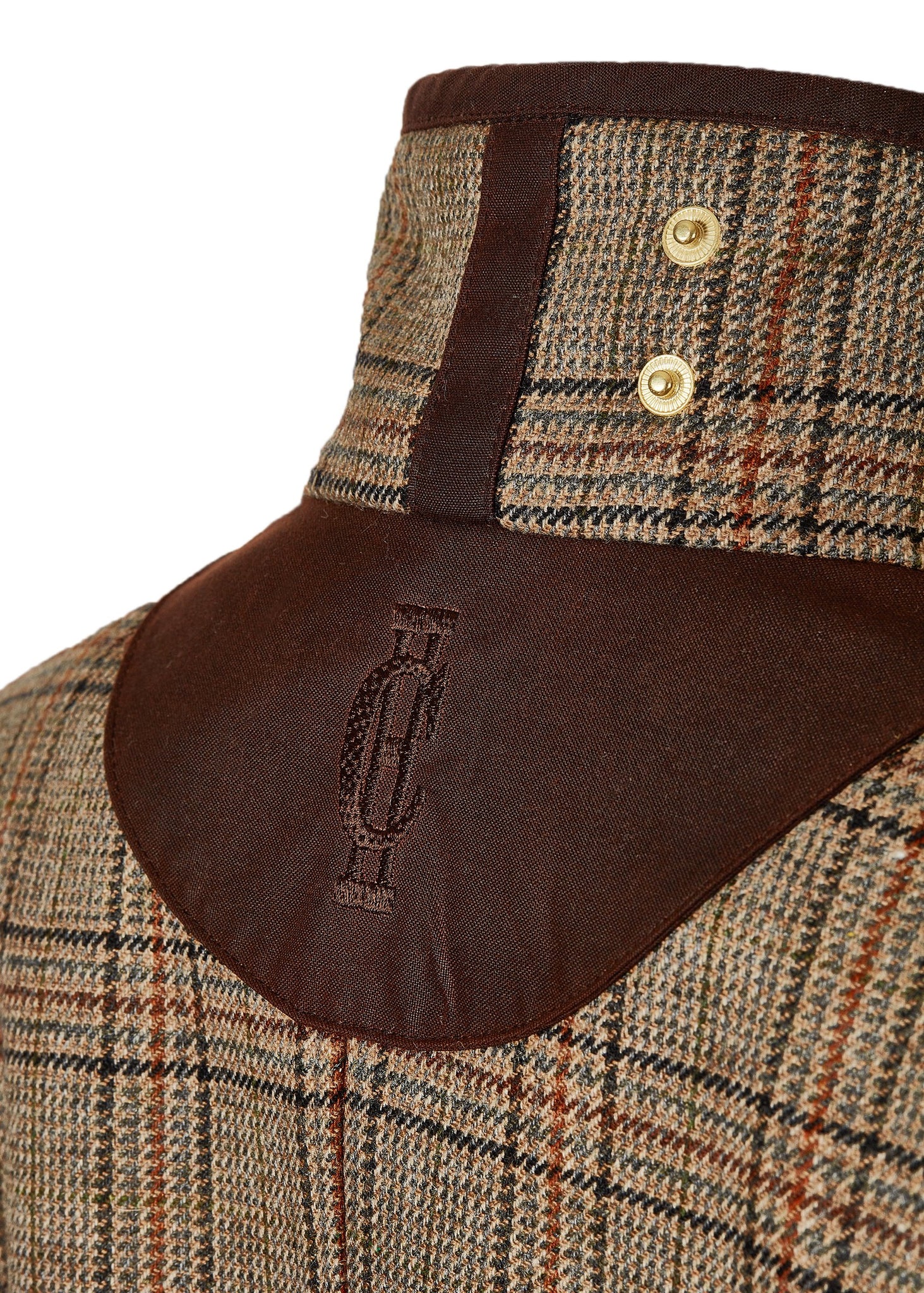 Collar of womans brown tartan tweed field coat