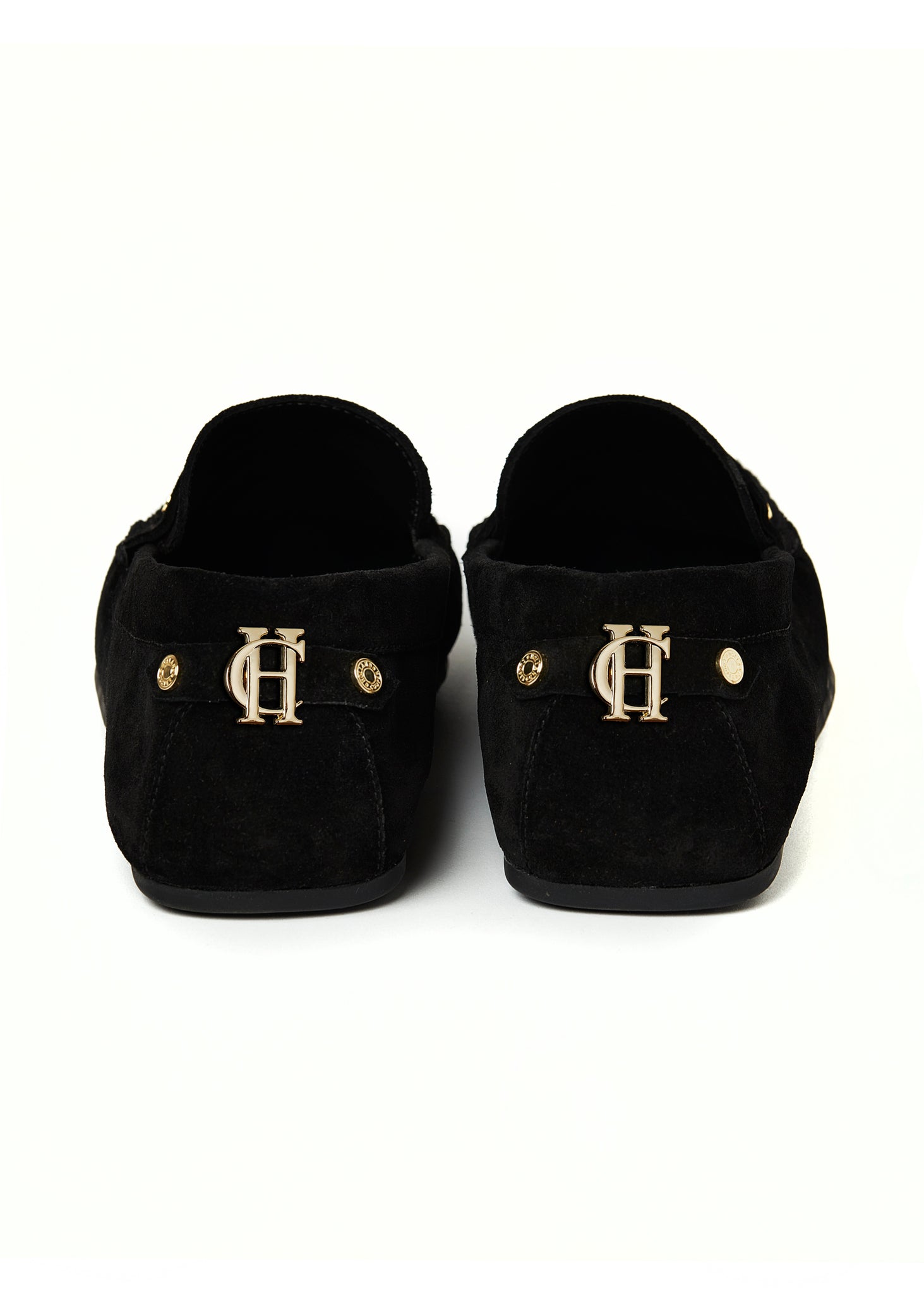back shot of classic black suede loafers with a leather sole and gold hardware