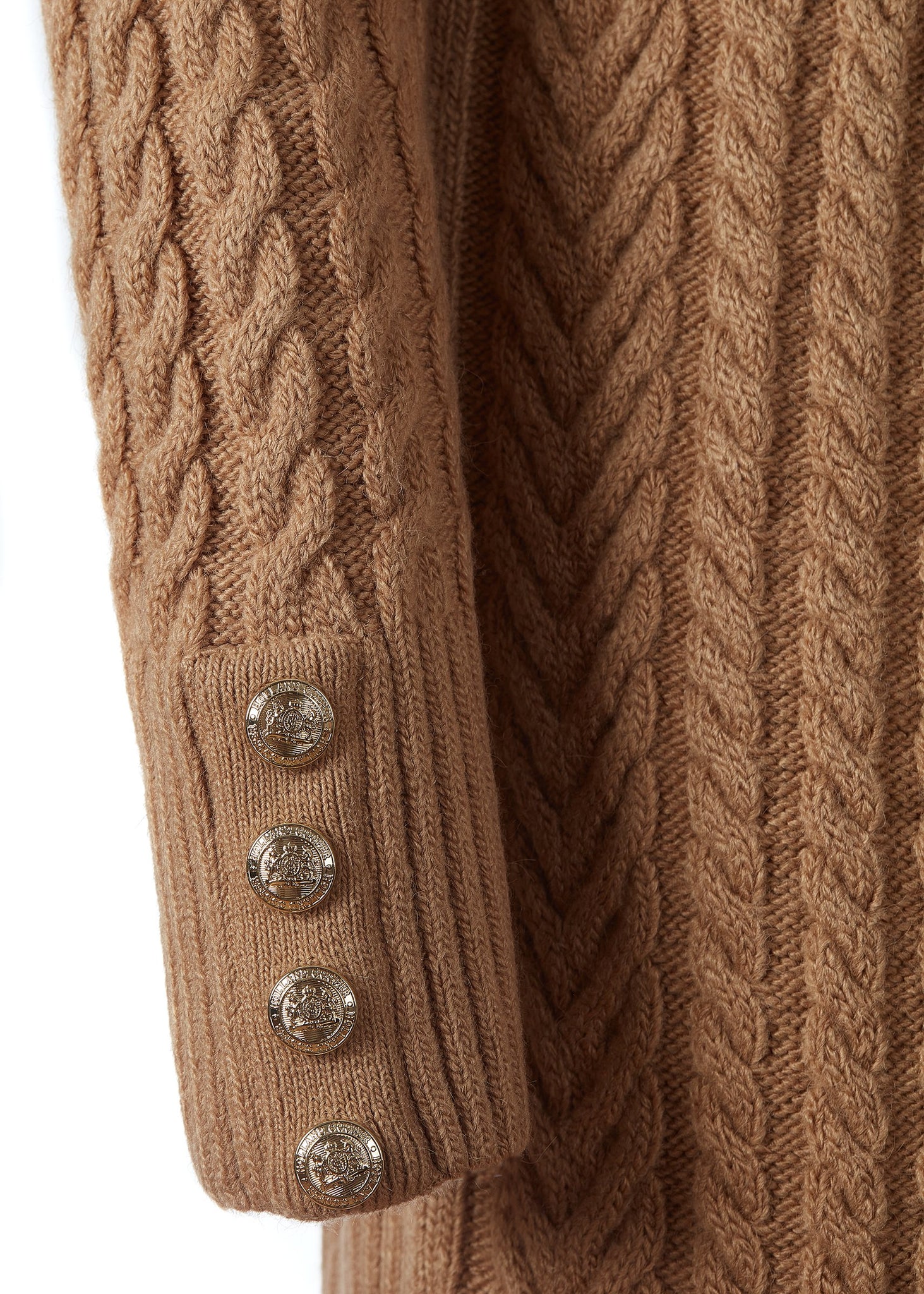 gold button details on cuffs of womens dark camel roll neck cable knit mini dress with ribbed cuffs and split ribbed hem