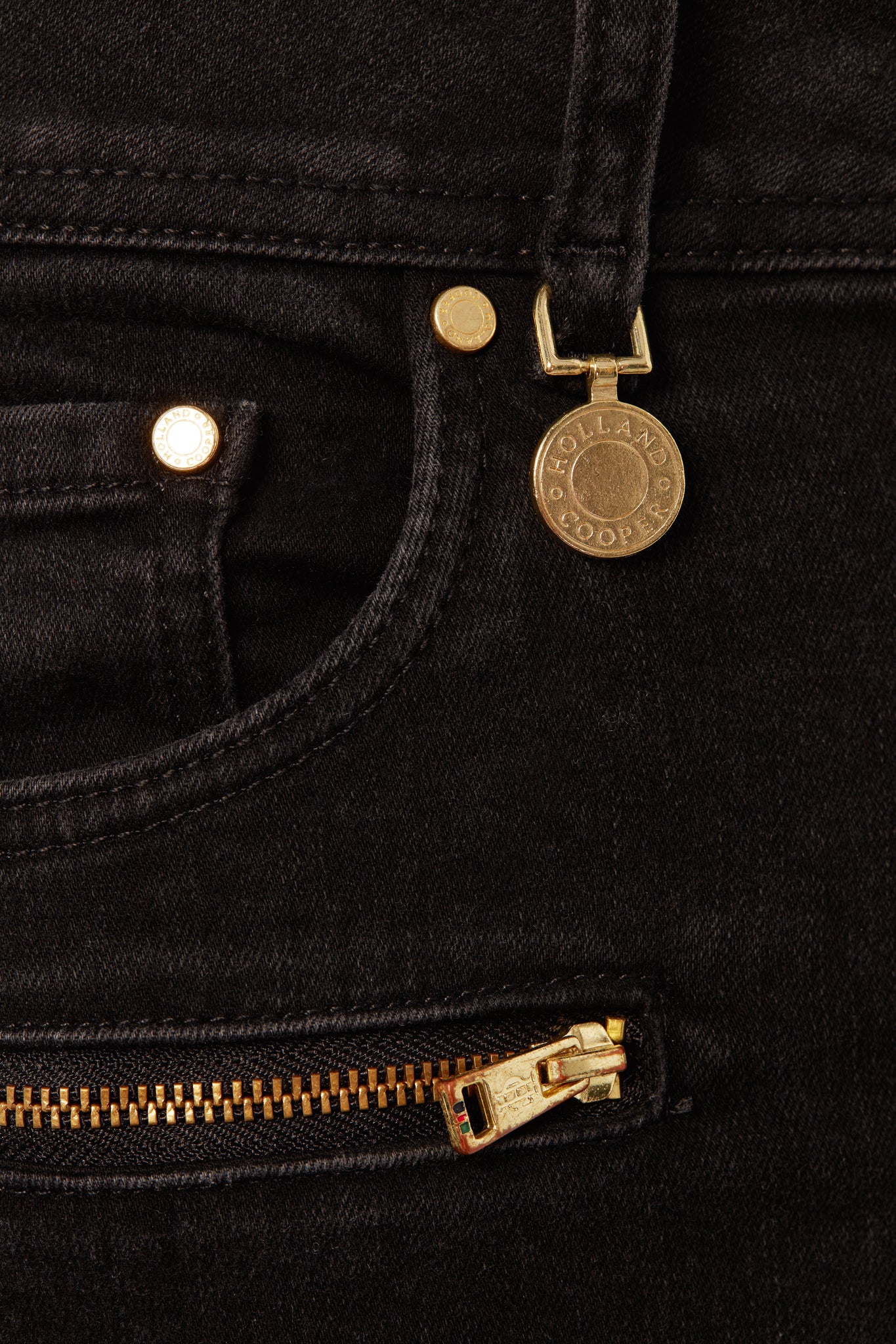 front pocket detail on womens high rise washed black skinny stretch jean with pin tuck biker panels to front and two open zip pockets on front with HC embroidery to left pocket facing