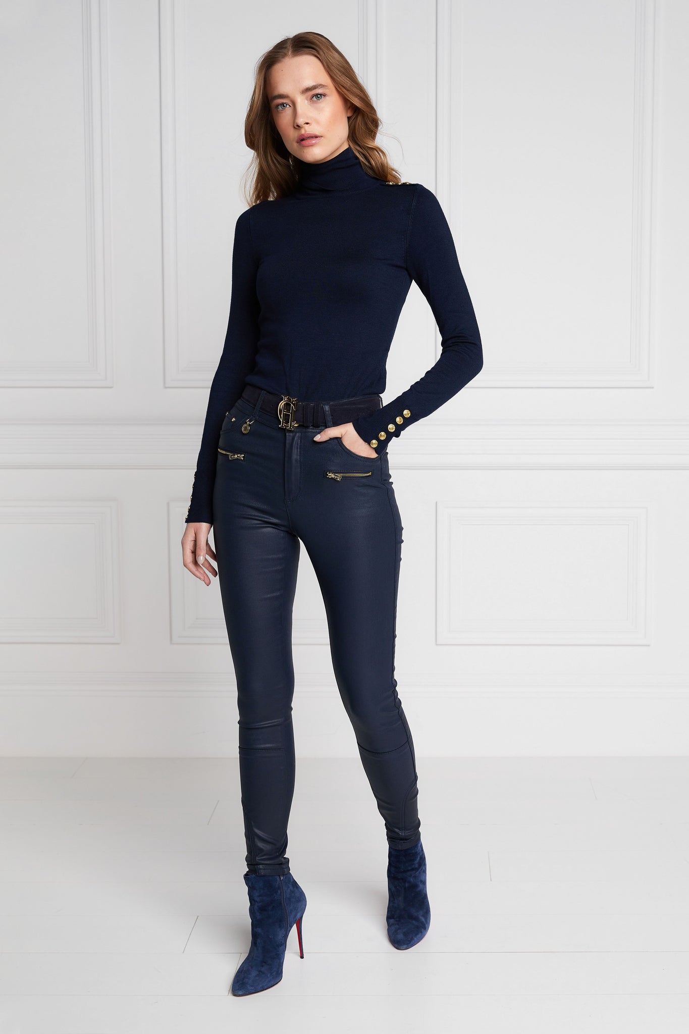 womens high rise blue coated skinny jean for a waxed look with jodhpur style seams with two open zip pockets to the front with HC branded pulls