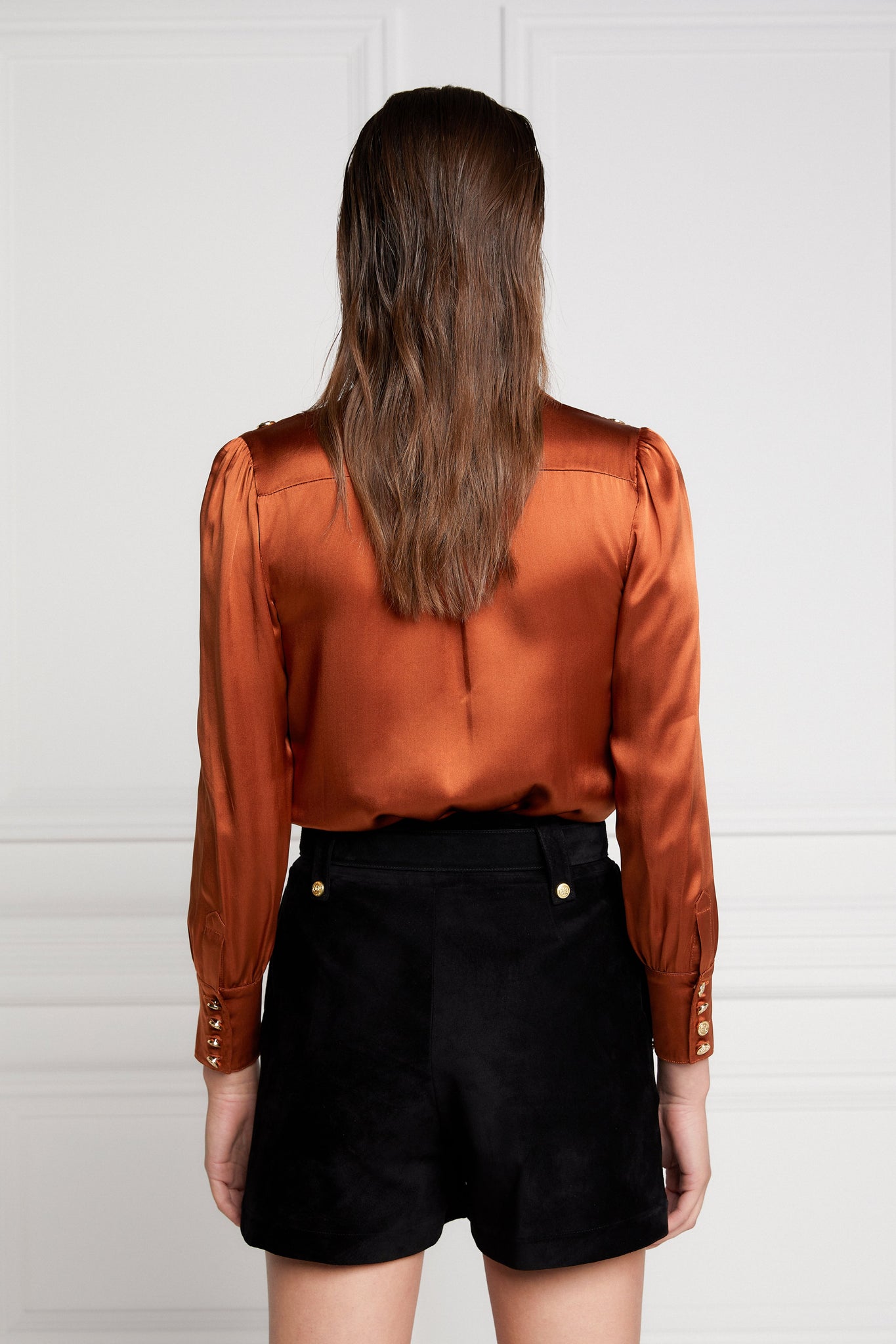 back of womens long sleeve burnt orange silk v neck blouse with gold buttons