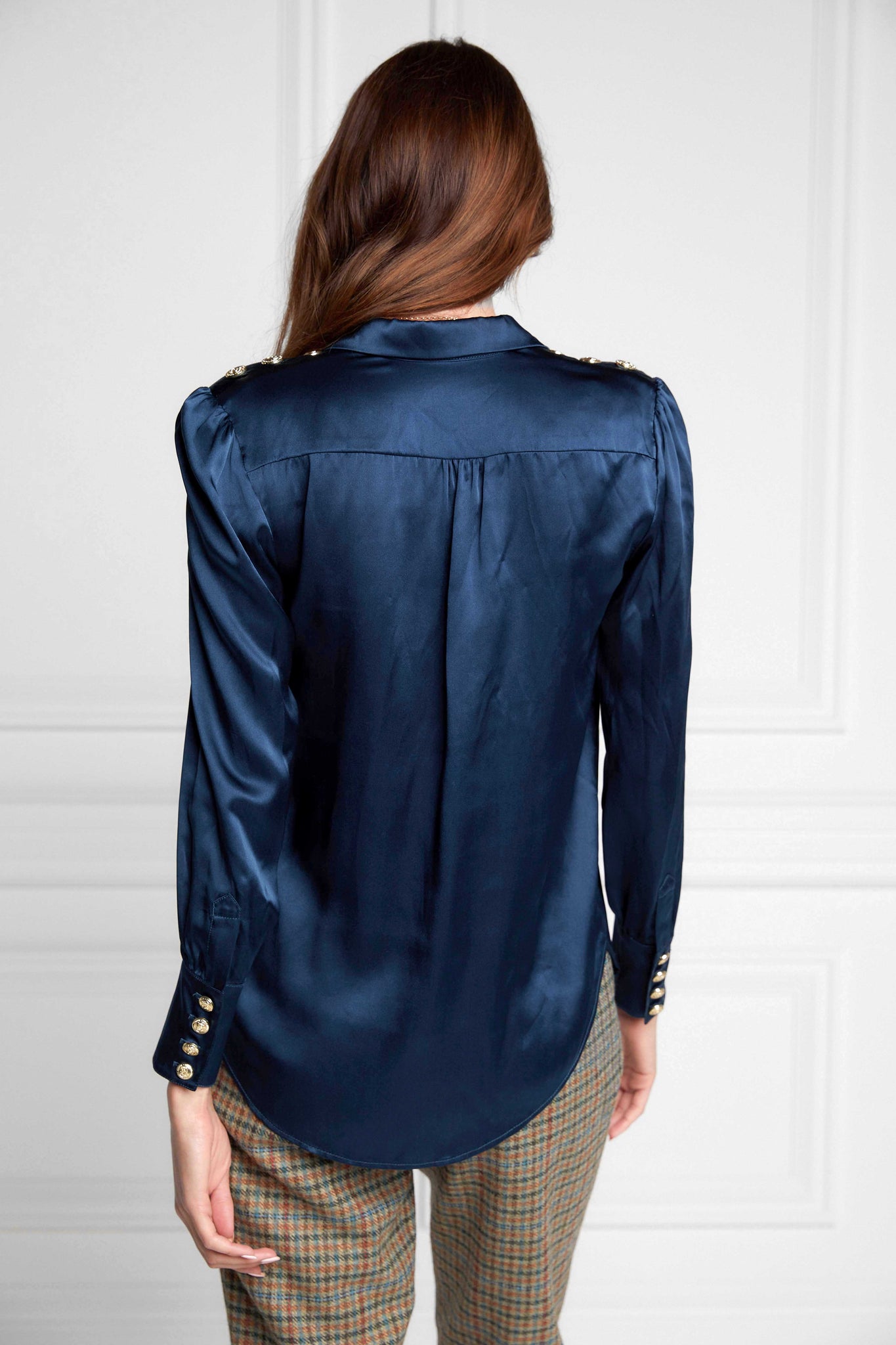 back of womens long sleeve blue silk v neck blouse with gold buttons