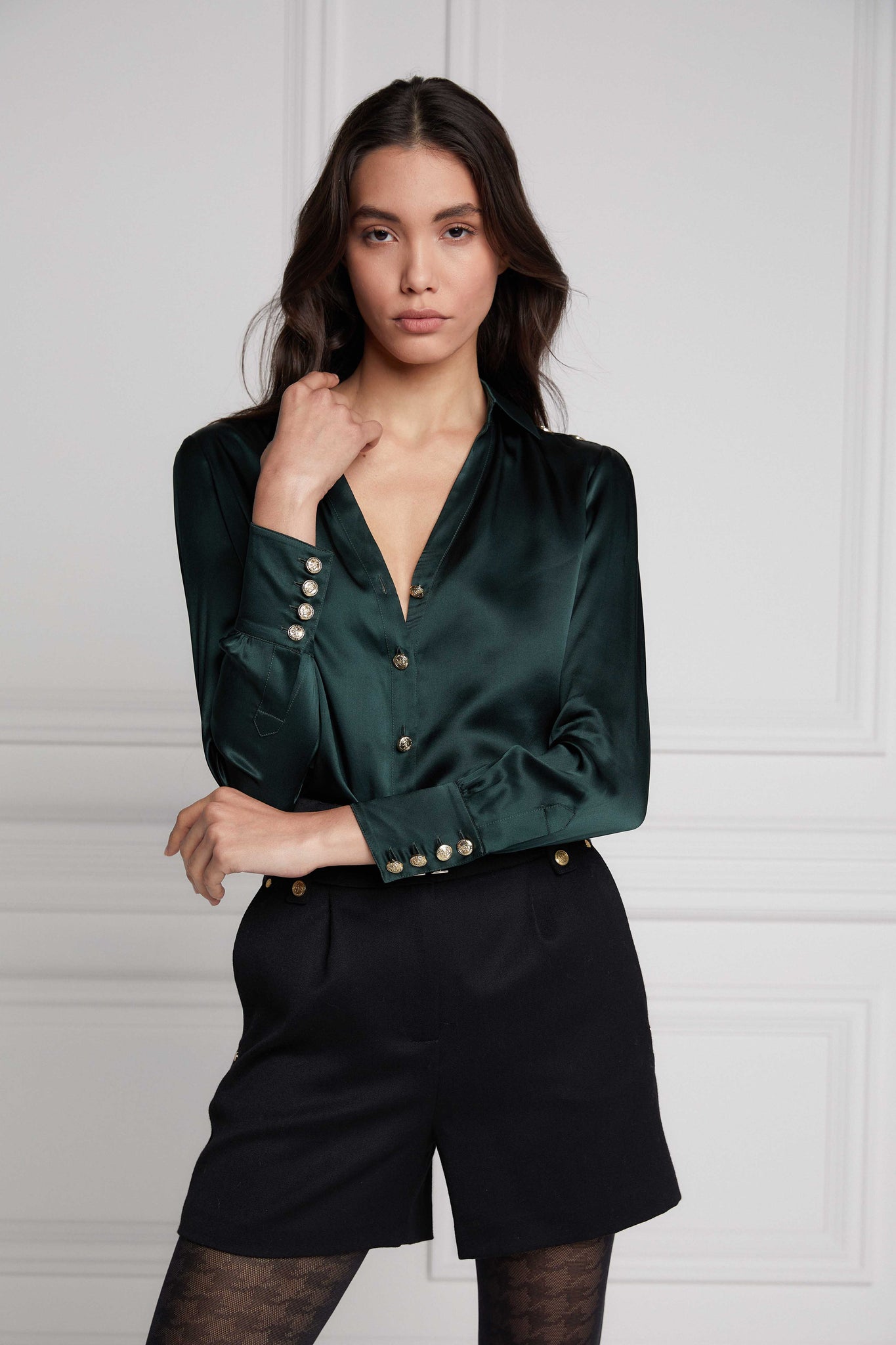 button detail on womens long sleeve dark green silk v neck blouse with gold buttons