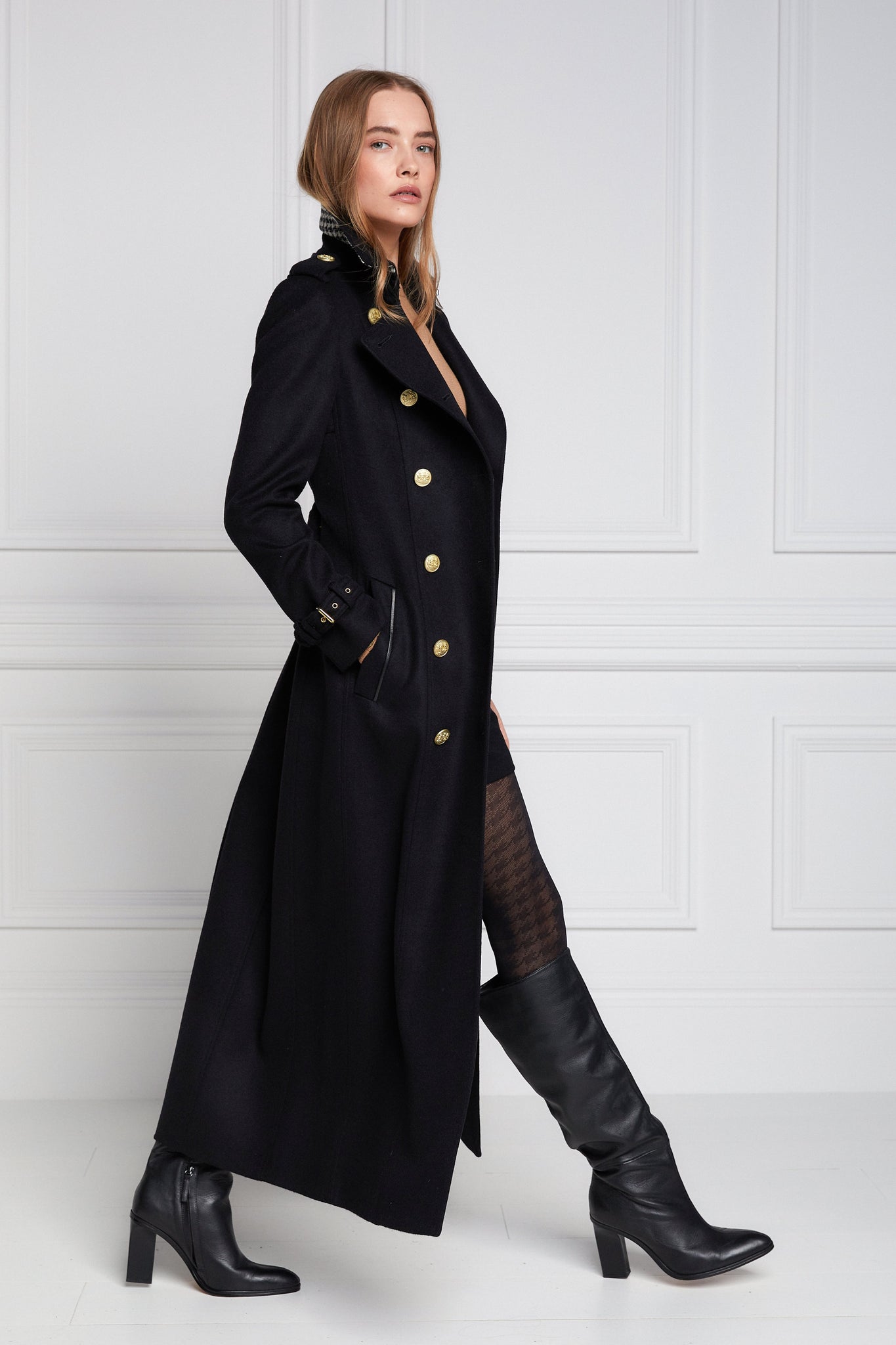 side of womens black double breasted full length wool trench coat