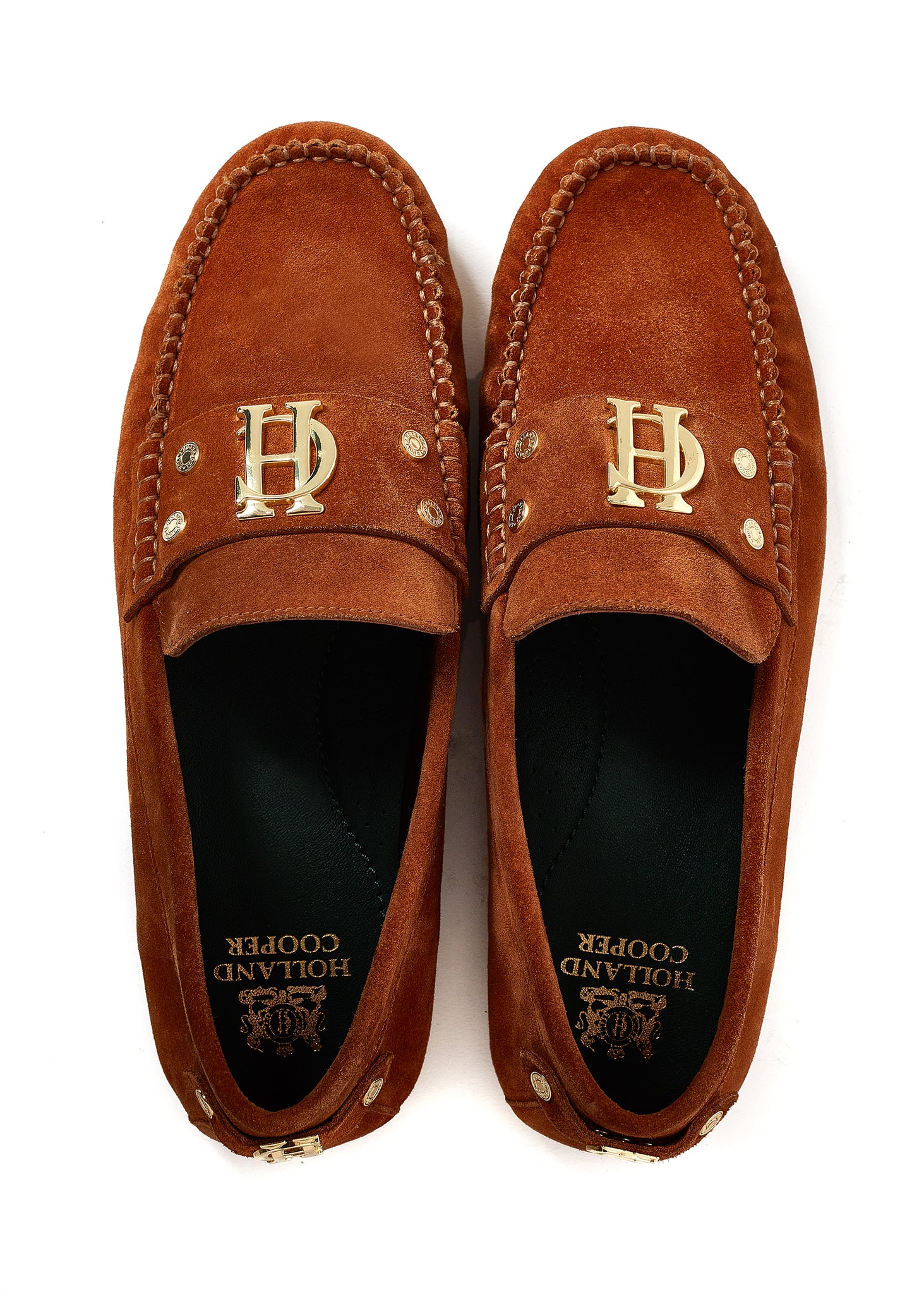 birds eye view of classic tan suede loafers with a leather sole and top stitching details and gold hardware with a dark green inner sole