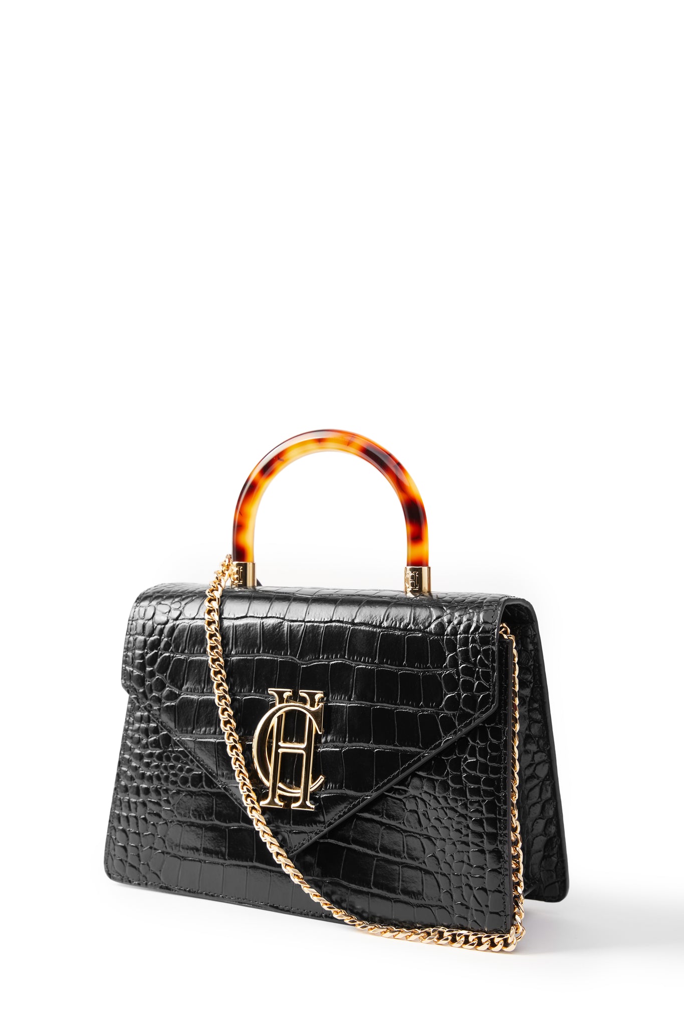 front shot of black croc embossed leather shoulder bag with acetate tortoiseshell top handle and gold chain