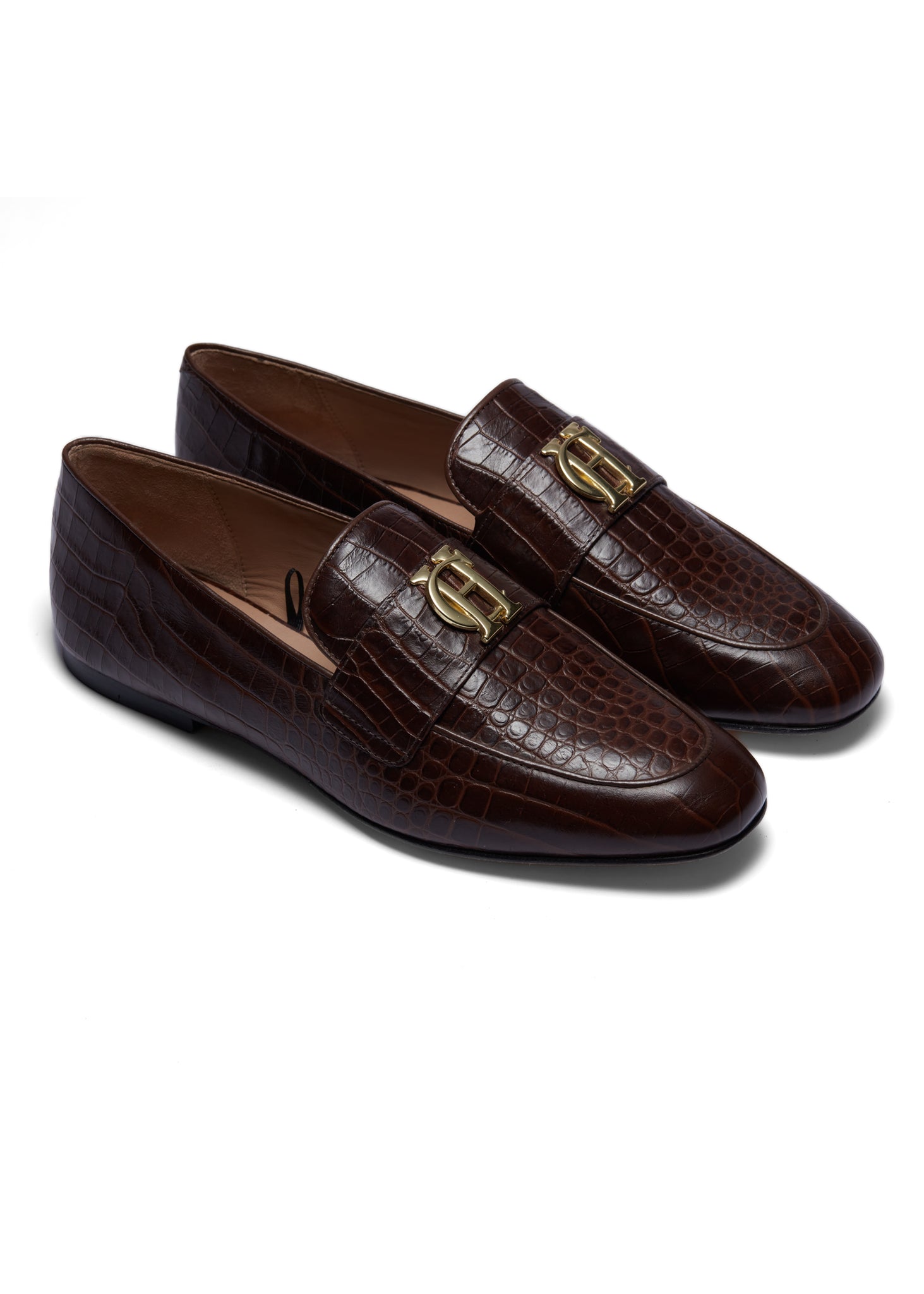 Brown croc embossed leather loafers with a slightly pointed toe and gold hardware to the top