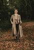 womens green and pink check single breasted full length wool coat with brown check tailored trousers and green wellingtons