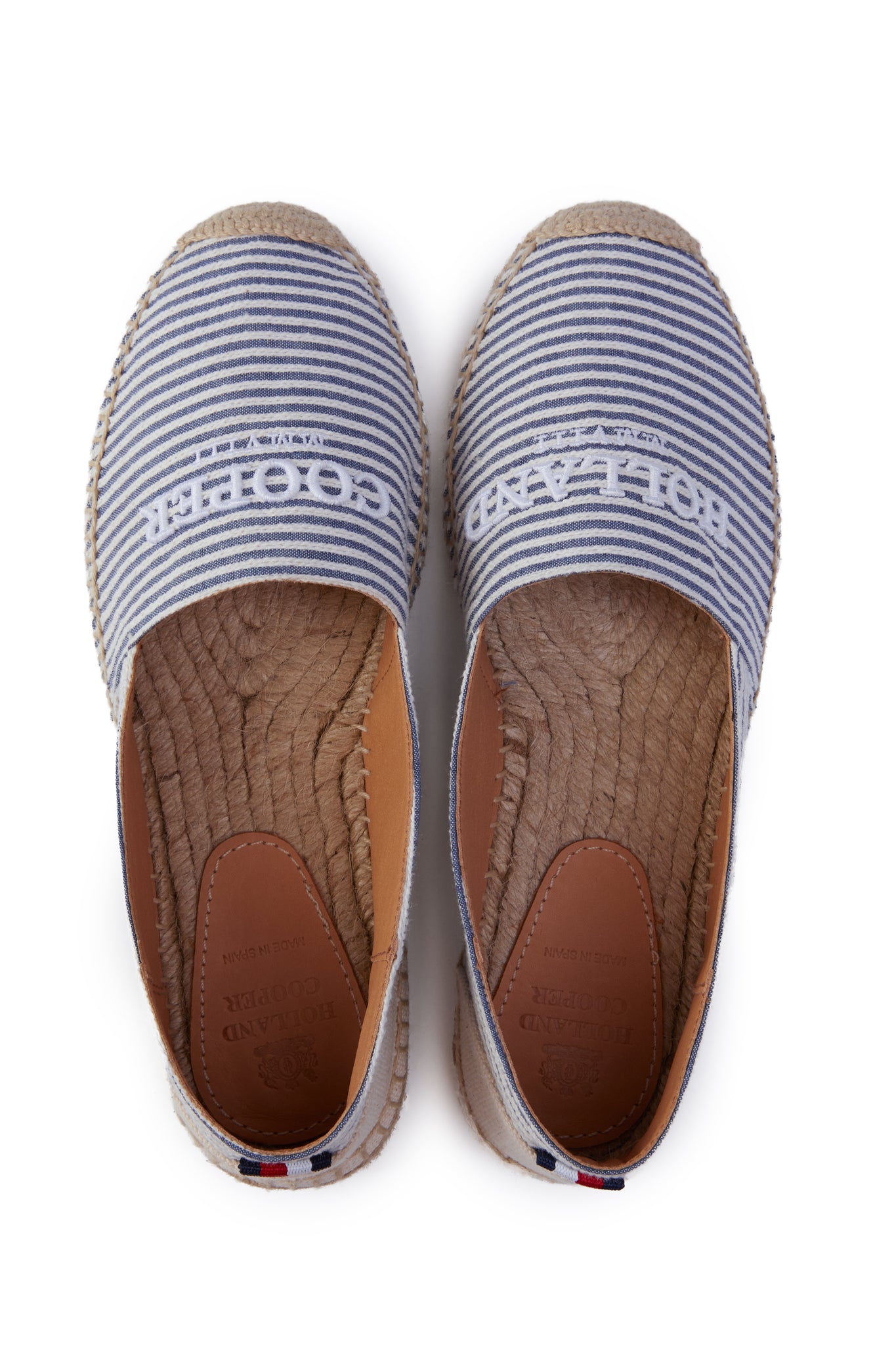 birds eye view of classic style white and blue striped canvas espadrille with plaited jute sole and jute toe cap with white embroidered branding on top