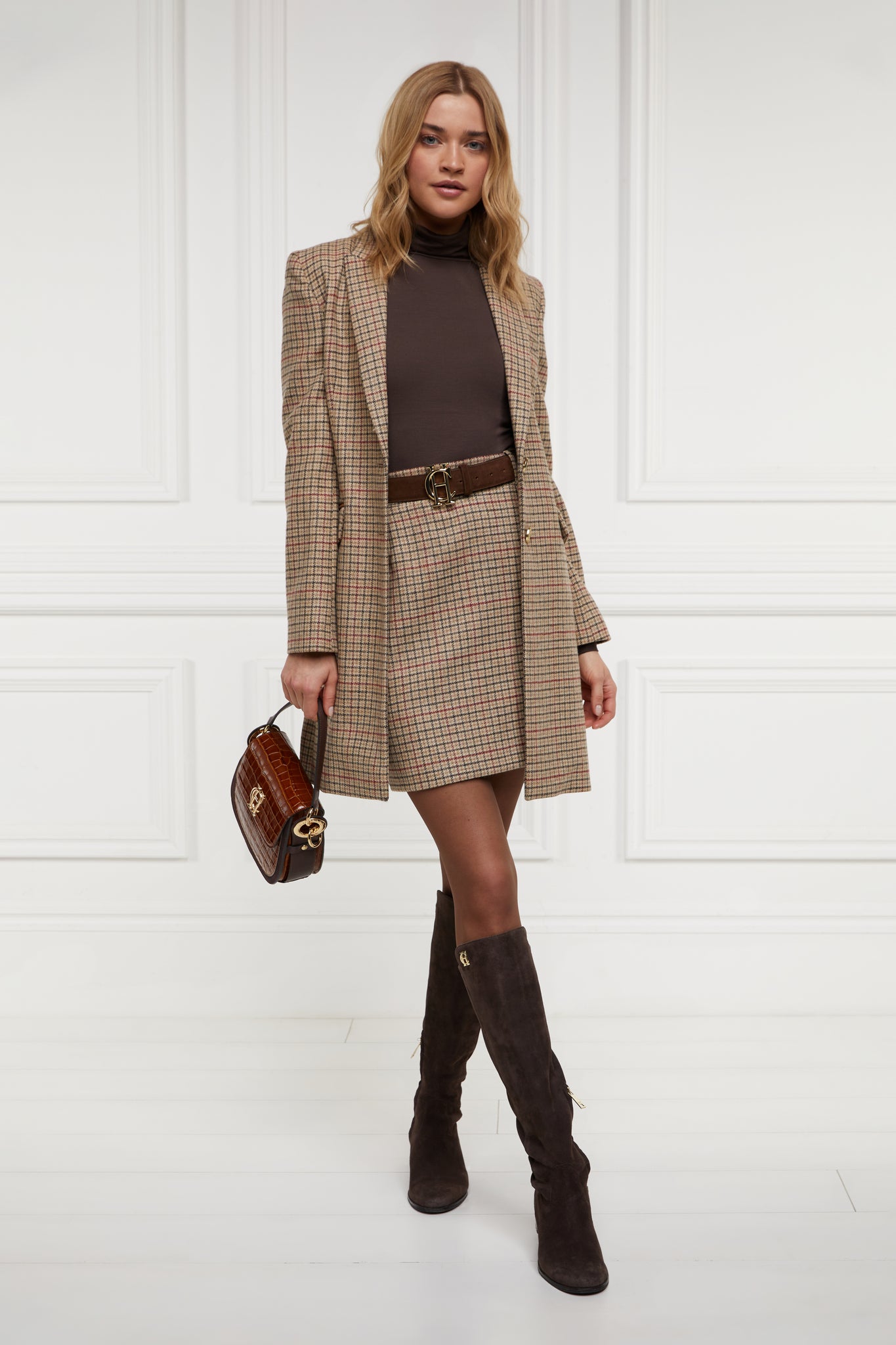 womens light brown and red tweed pencil mini skirt with concealed zip fastening on centre back with gold hc button above zip worn with mid length single breasted coat in matching colourway