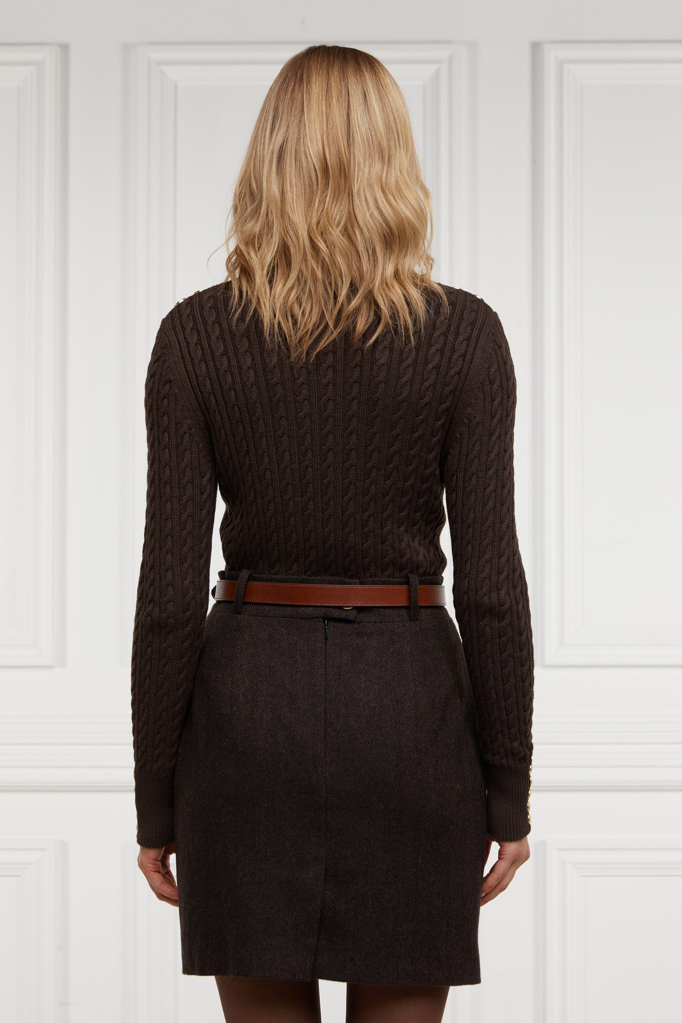 back of womens brown wool pencil mini skirt with concealed zip fastening on centre back with gold hc button above zip
