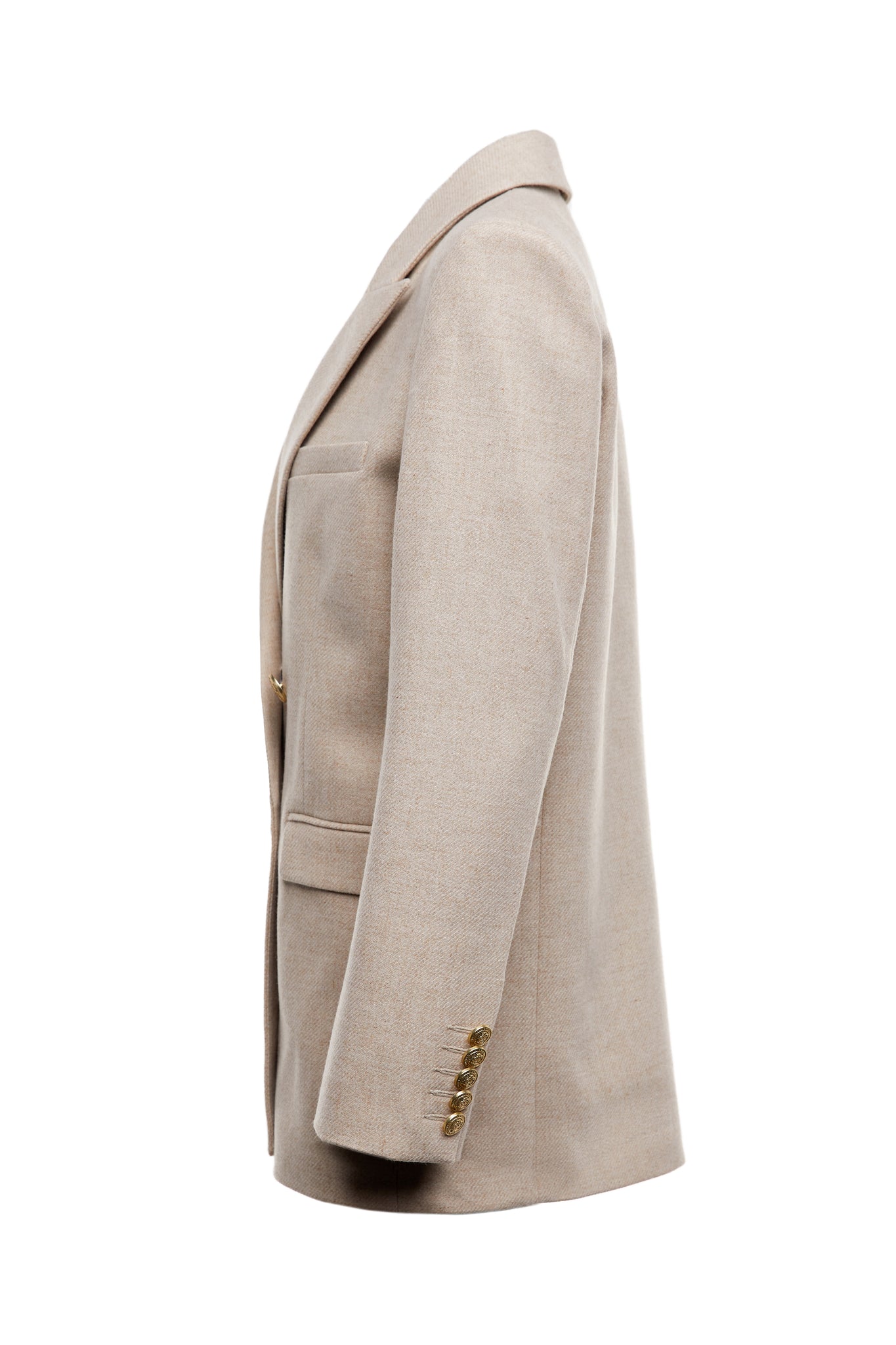 side of longline double breasted wool blazer in oatmeal tailor made in britain with relaxed fit welt pockets and gold buttons on the front and cuffs