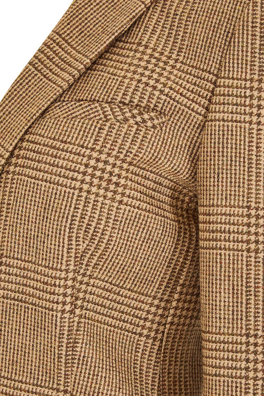 pocket detail of tan brown tweed womens coat with gold hardware and brown suede detailing