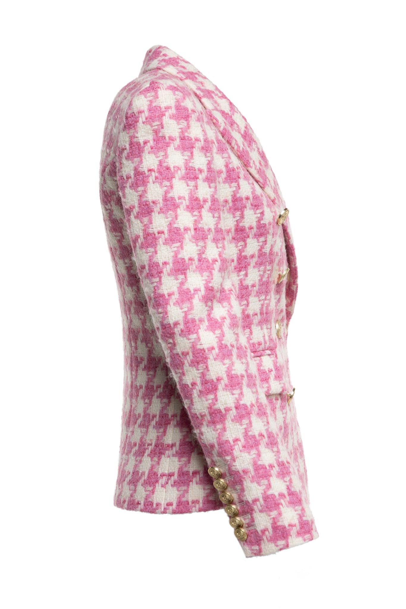 side of pink and white large scale houndstooth fitted blazer double breasted style but with only single button fastening to the one central button for more form fitted tailored look finished with two pockets at hips and gold button details on front and cuffs