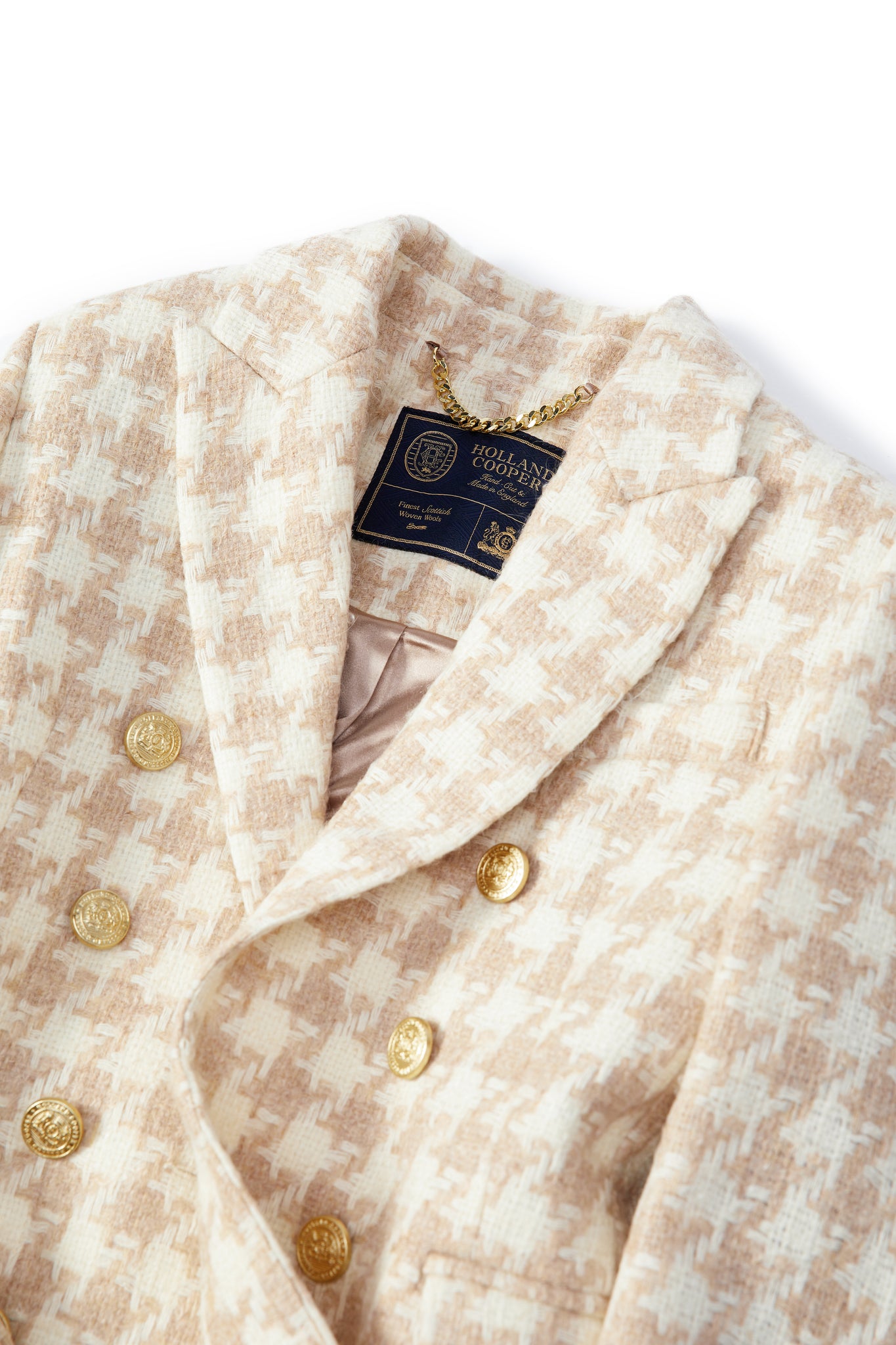 flat lay collar detail of camel and cream houndstooth wool womens coat with gold hardware