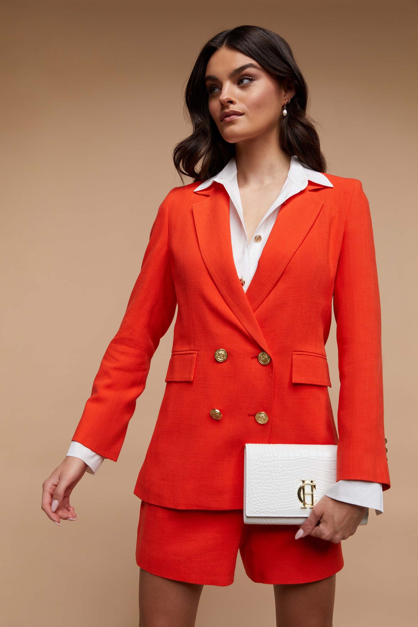 double breasted linen blazer in orange with two hip pockets and gold button detials down front and on cuffs and handmade in the uk 