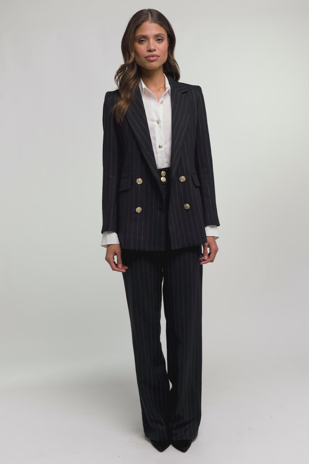 double breasted wool blazer in navy and cream chalk pinstripe with two hip pockets and gold button detials down front and on cuffs and handmade in the uk