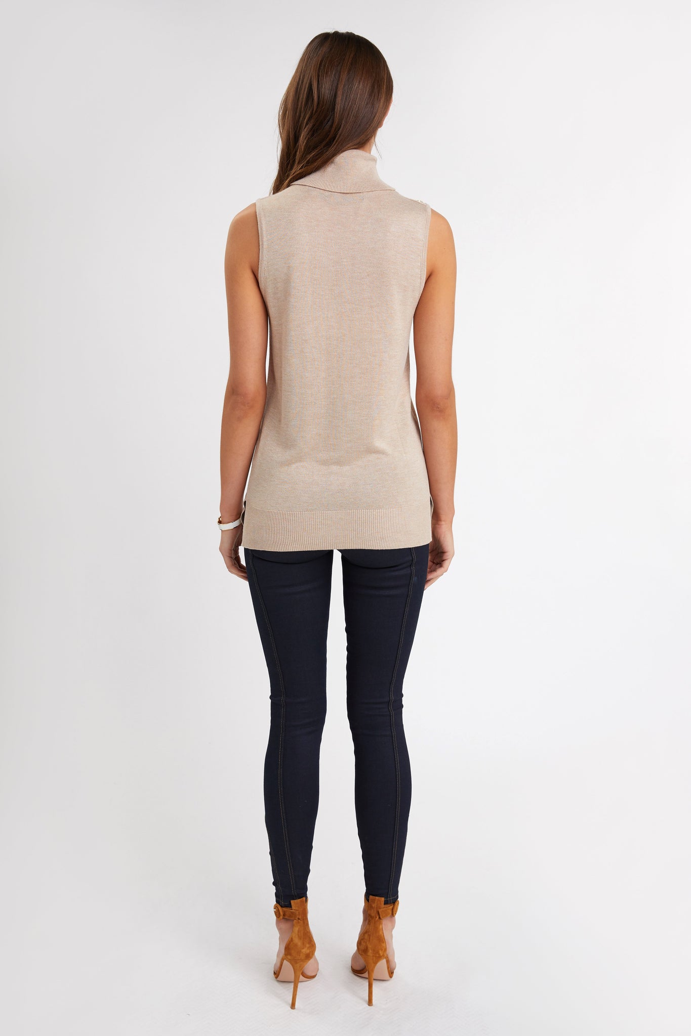 back of fitted lightweight sleeveless rollneck knit in camel with gold button detail across shoulders