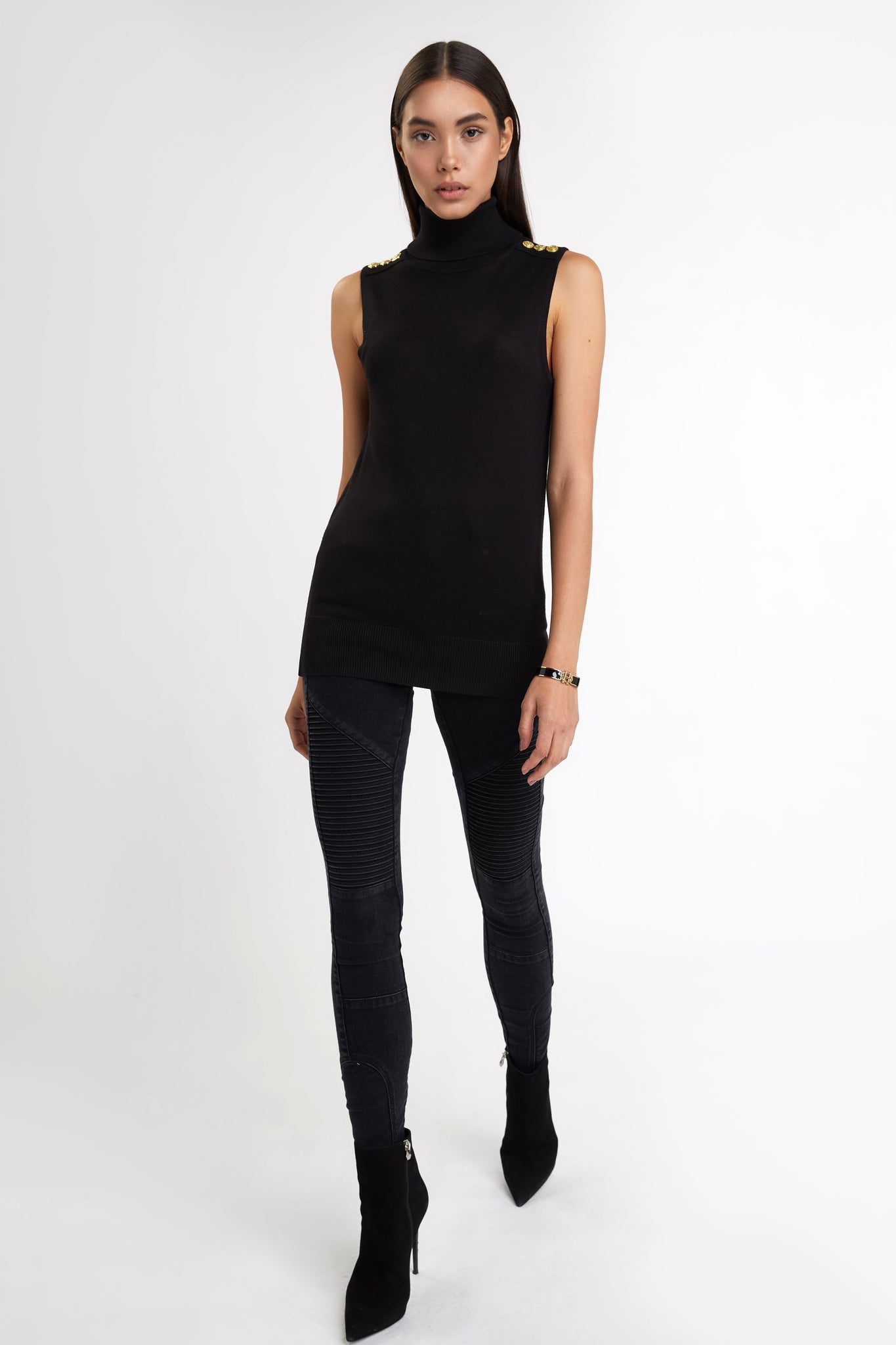 fitted lightweight sleeveless rollneck knit in black with gold button detail across shoulders