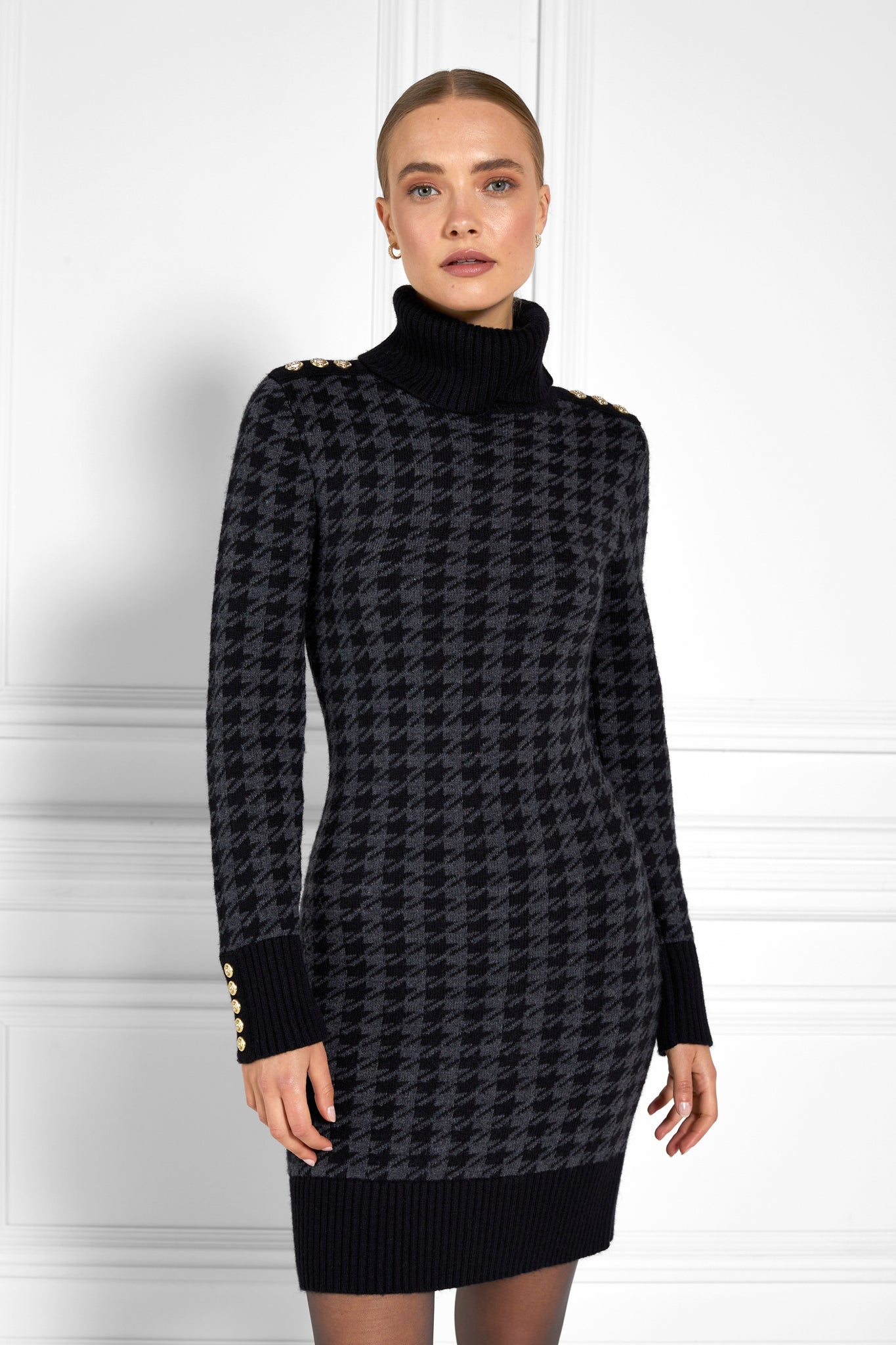 womens black and dark grey houndstooth roll neck jumper dress with contrast black cuffs and ribbed hem with gold button detail on the cuffs and shoulders