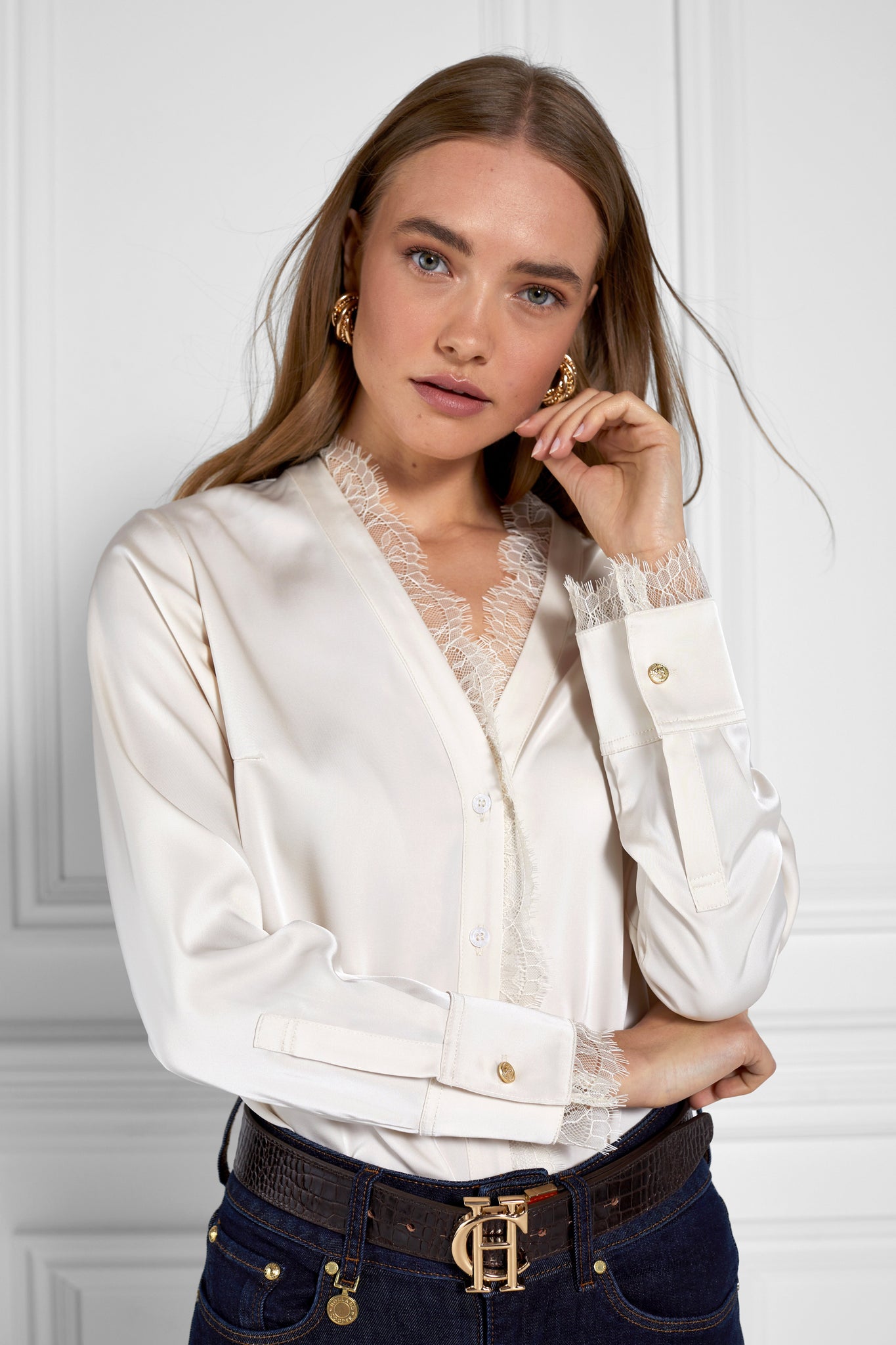 womens white long sleeve silk v neck blouse with white lace hem details