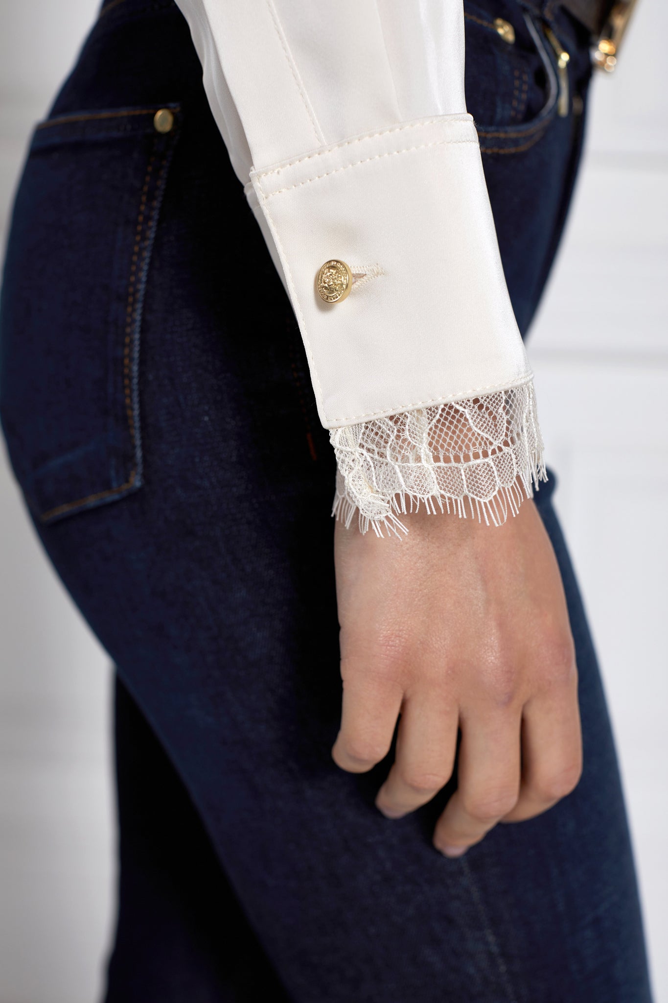 lace hem detail on womens white long sleeve silk v neck blouse with white lace hem details