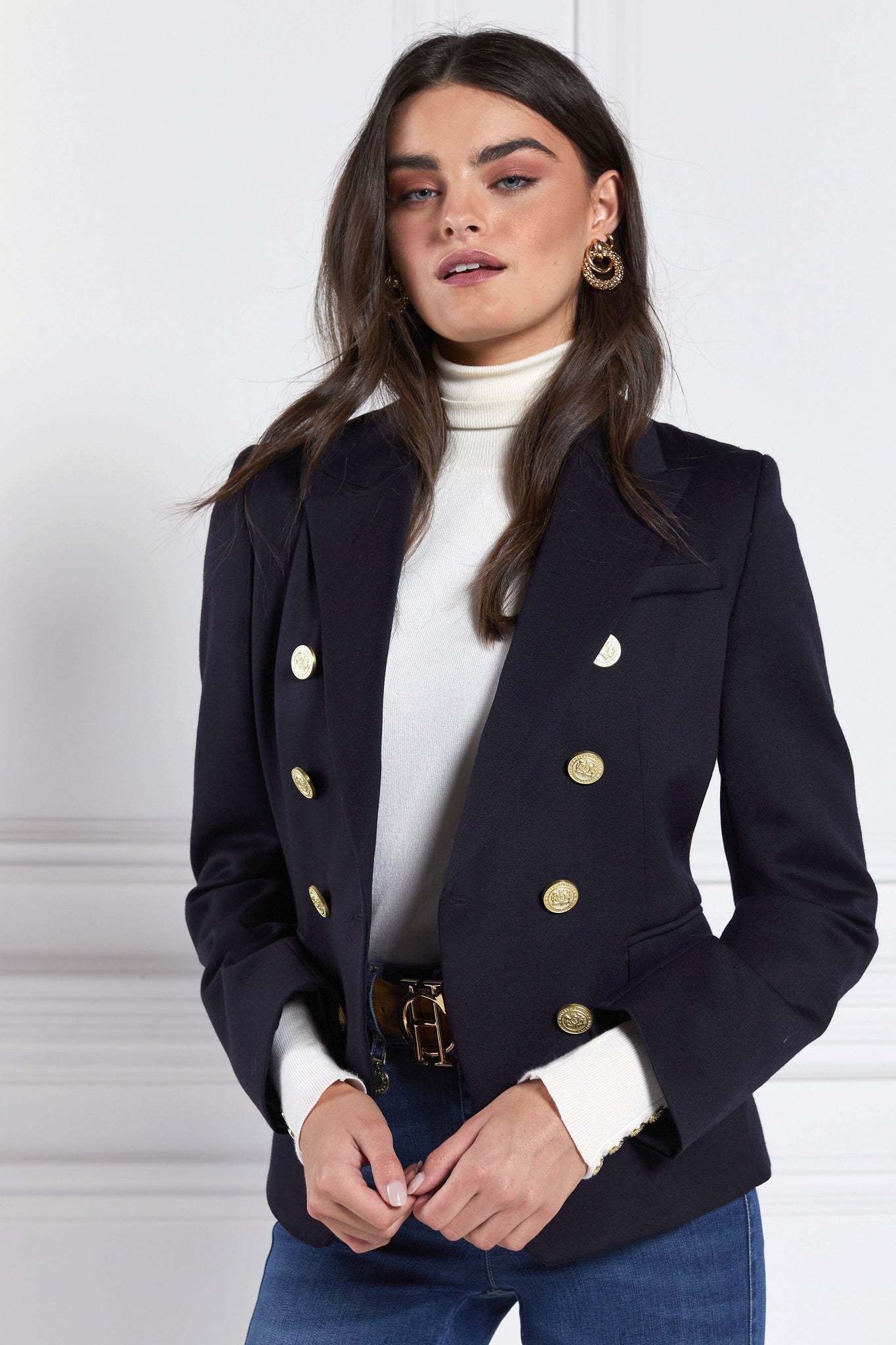 British made double breasted blazer that fastens with a single button hole to create a more form fitting silhouette with two pockets and gold button detailing this blazer is made from navy barathea fabric