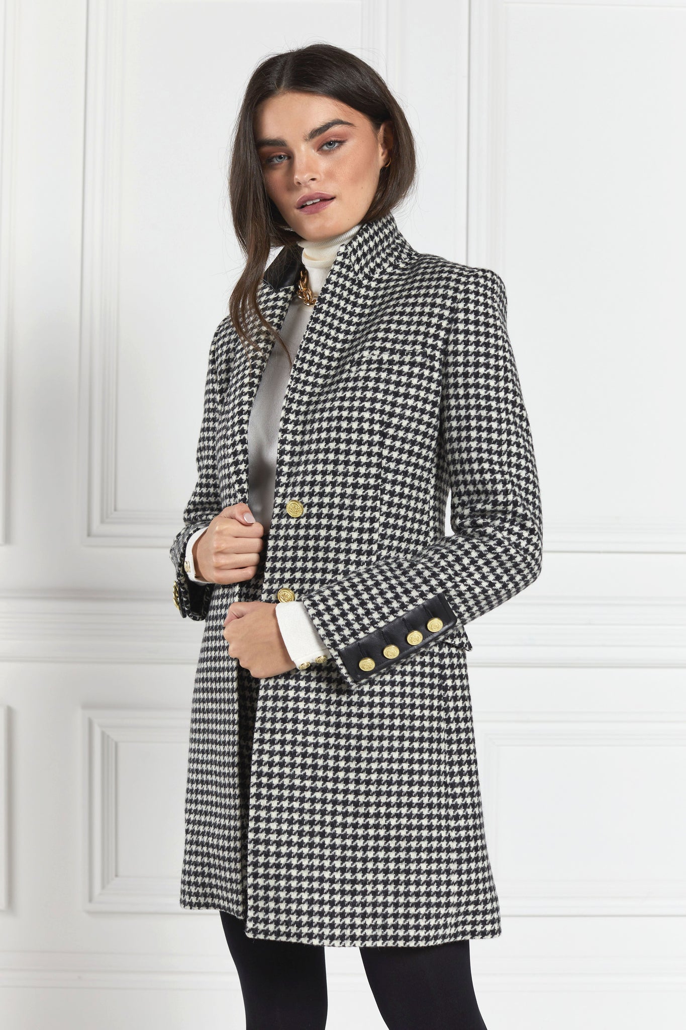 white and black houndstooth tweed womens coat with gold hardware and black leather detailing