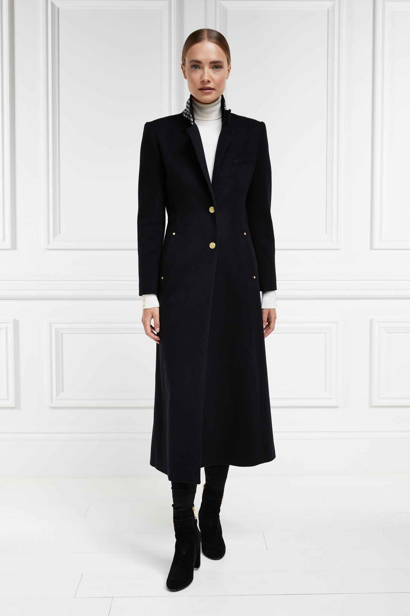black single breasted full length wool coat with black and white houndstooth under collar detail