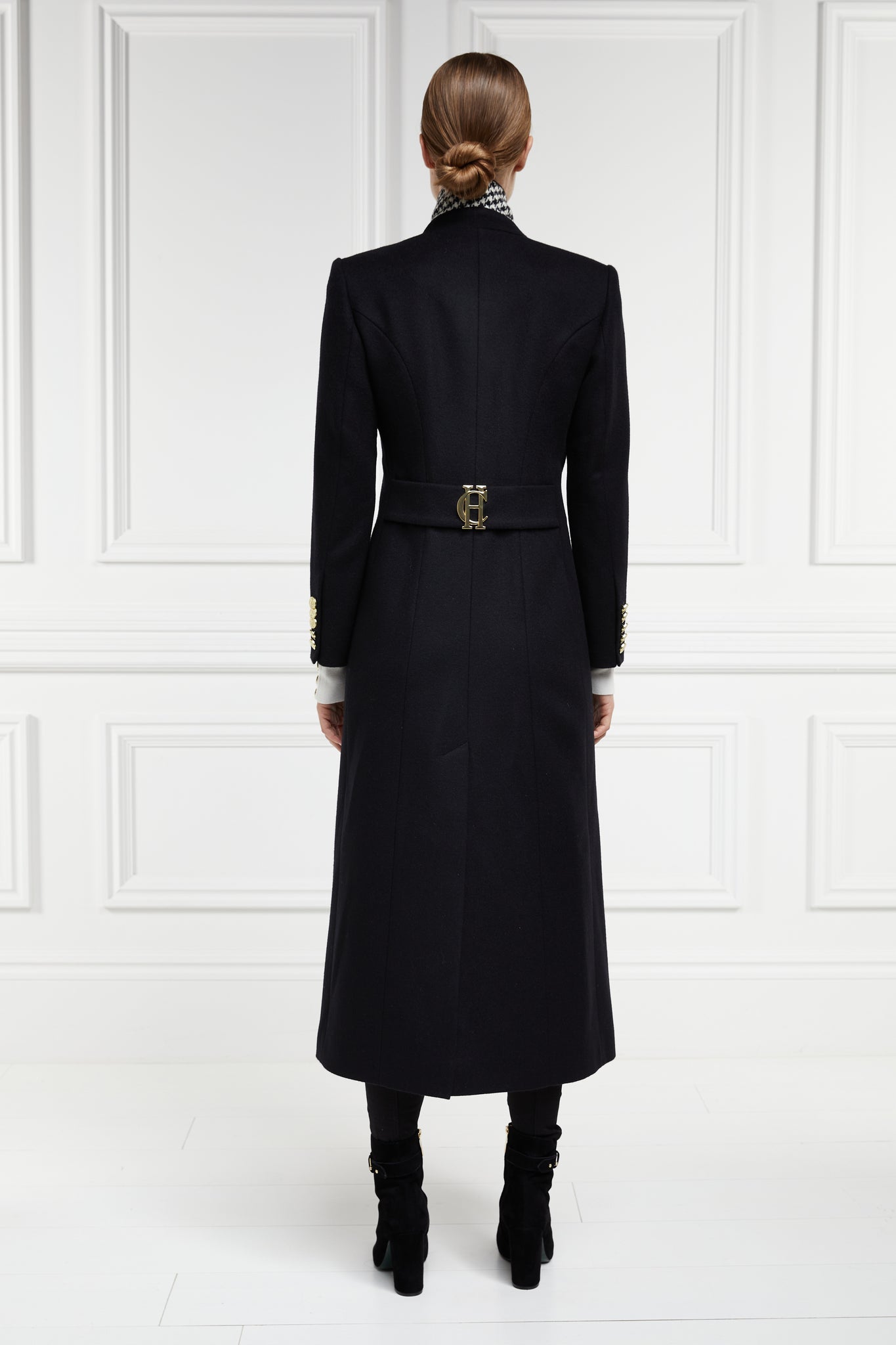black single breasted full length wool coat with black and white houndstooth under collar detail and gold HC