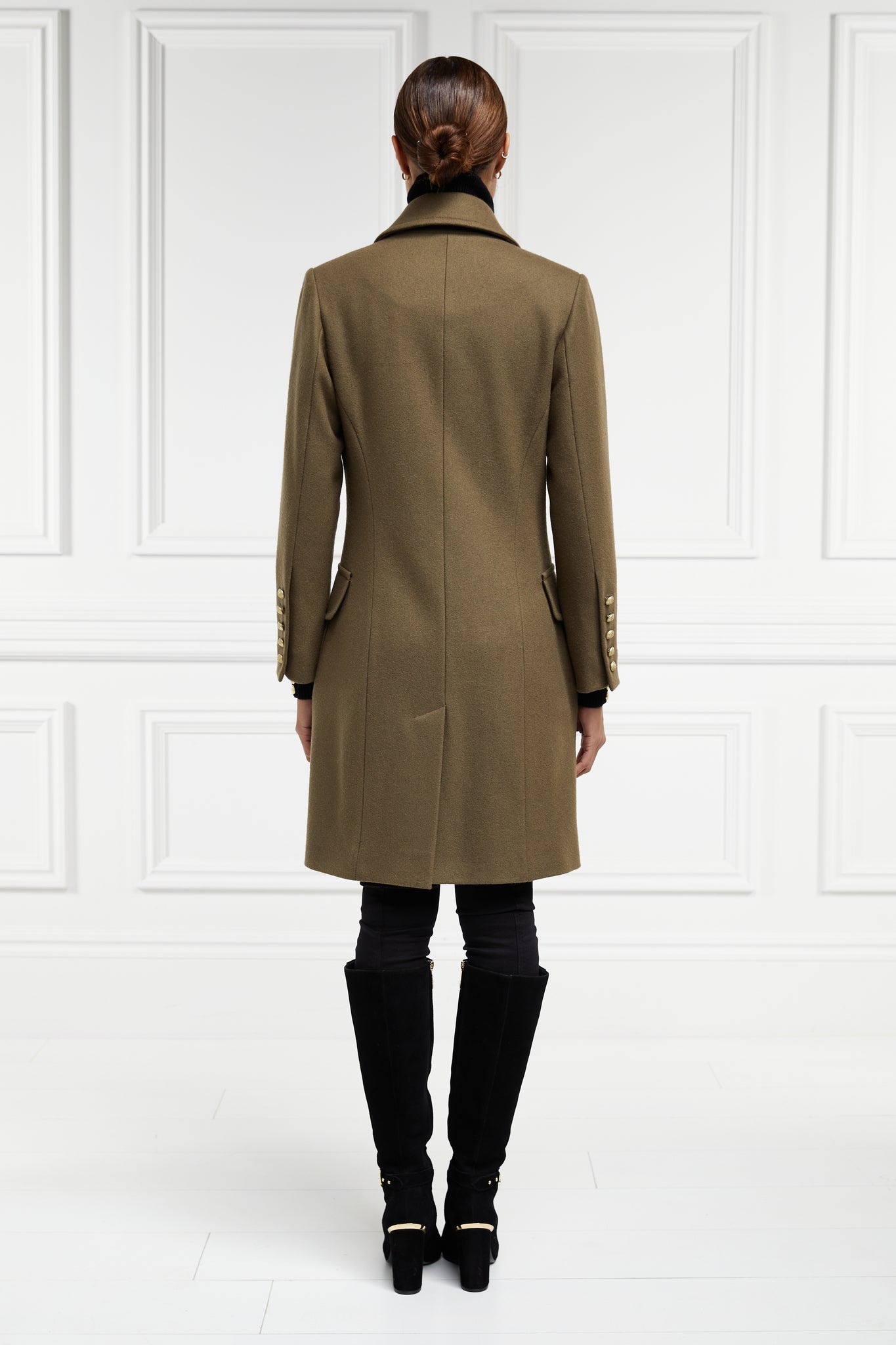 Back of womens khaki knee length wool military double breasted coat
