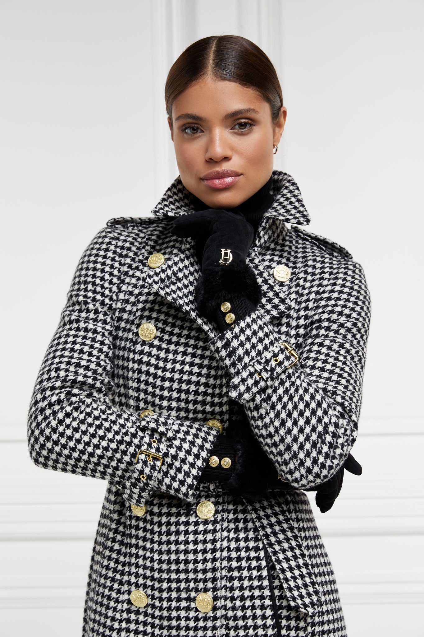 womens black and white houndstooth double breasted full length wool trench coat with womens black suede faux fur cuff gloves
