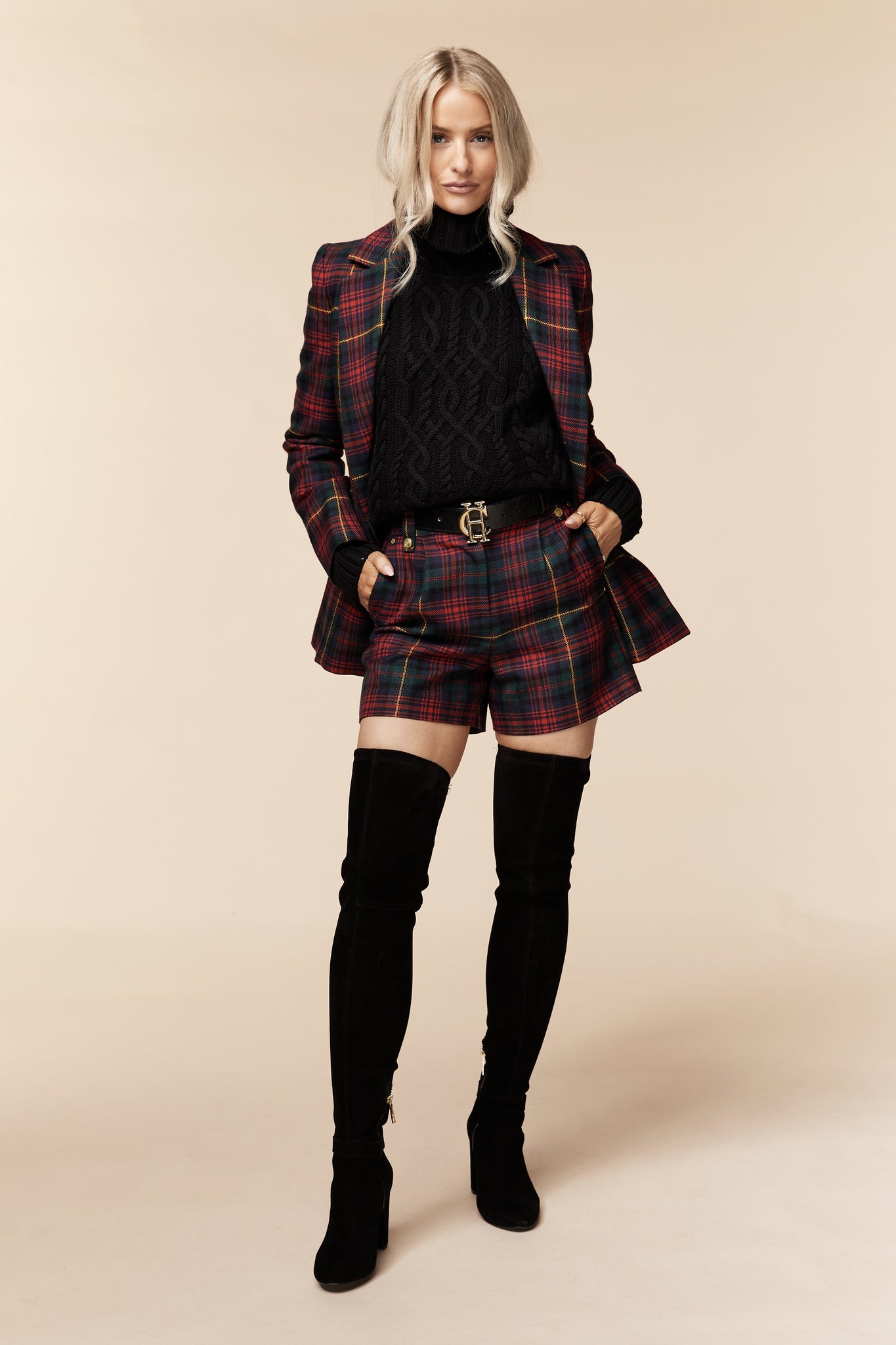 womens red green and blue tartan high rise tailored shorts with two single knife pleats and centre front zip fly fastening with twin branded gold stud buttons and side hip pockets with branded rivet detailing at top and bottom of pockets under matching double breasted blazer