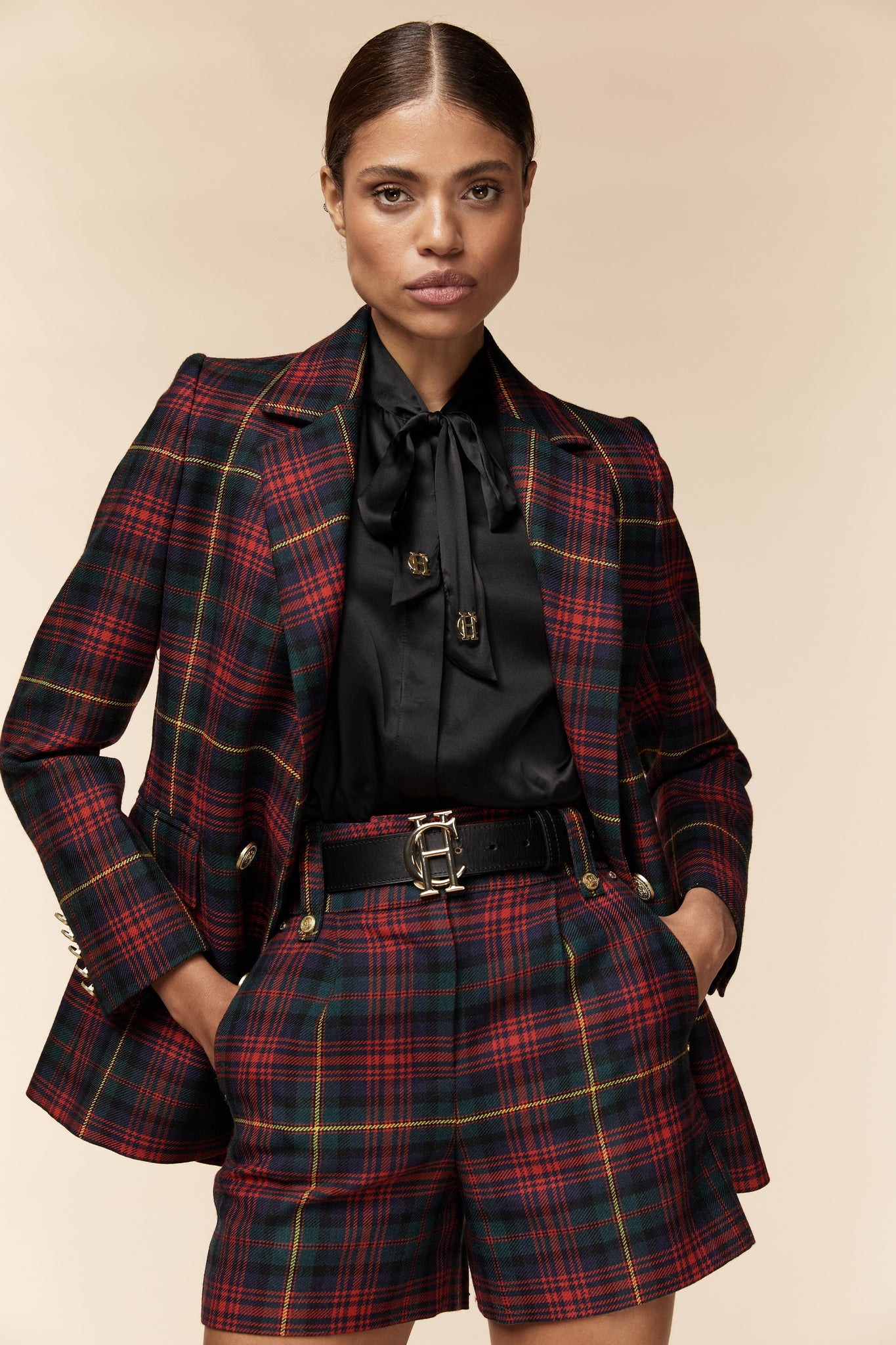 [packshot]womens red green and blue tartan high rise tailored shorts with two single knife pleats and centre front zip fly fastening with twin branded gold stud buttons and side hip pockets with branded rivet detailing at top and bottom of pockets worn with matching double breasted blazer
