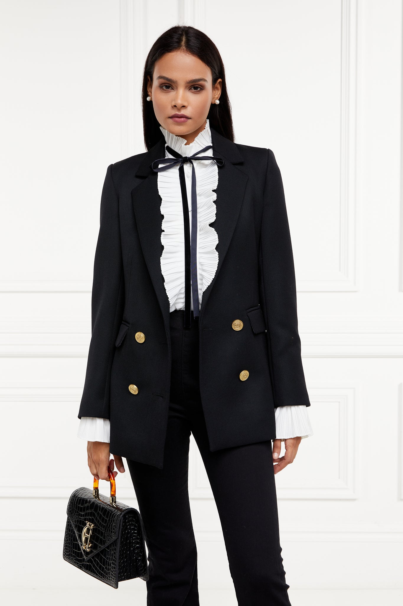 womens relaxed fit white polyester shirt with ruffled front collar and cuffs and removable black tie detail and double breasted black tweed blazer and black croc embossed bag