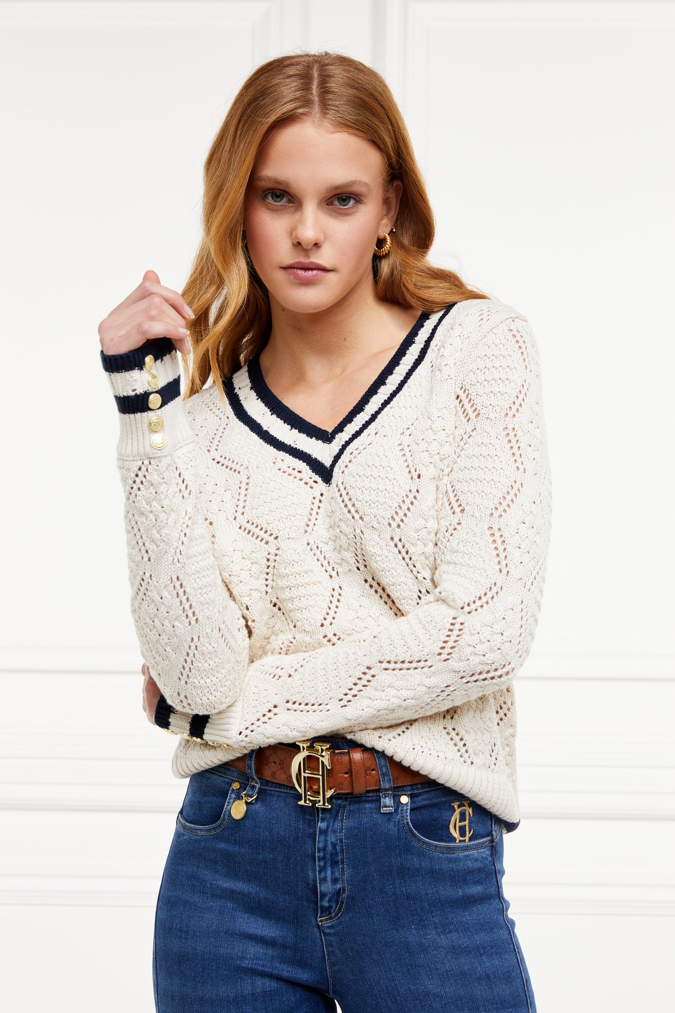 A cricket style v neck lightweight knit in cream with thick ribbed  navy double stripe trims on cuffs and neckline