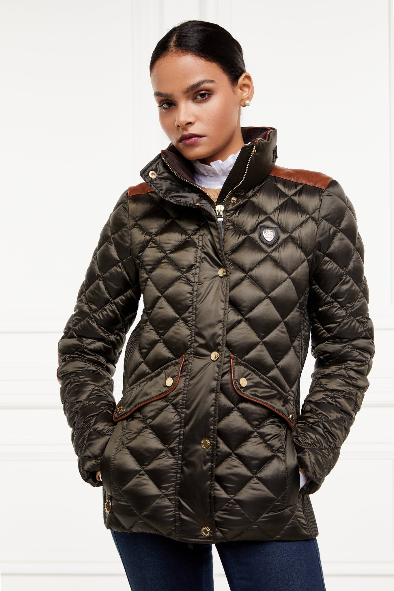 womens diamond quilted khaki jacket with contrast tan leather elbow and shoulder pads large front pockets and shirred side panels