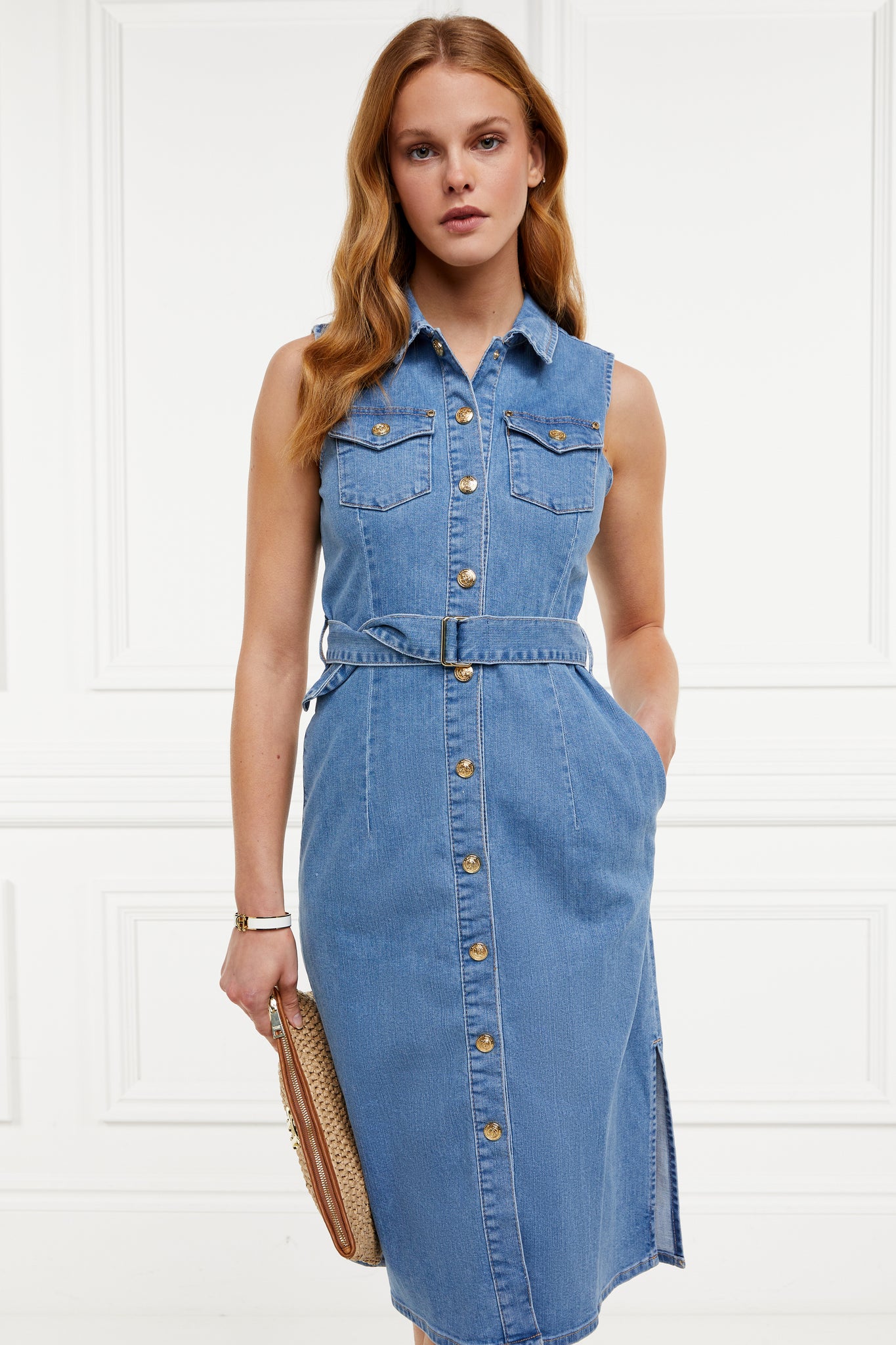 womens blue denim sleeveless midi dress with tie around the waist and gold buttons down the front